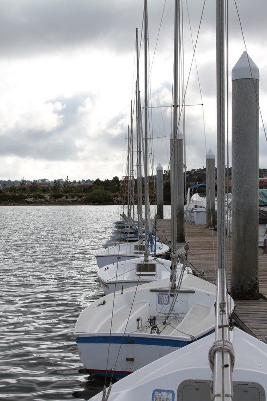 Sailboats used for recreation and instruction wait alongside one of the docks aboard Marine Corps Recruit Depot San Diego's Boathouse and Marina. Beginning April 30, sailing classes will be held every other Saturday and Sunday from 10 a.m. to 4 p.m. Classes end October 16.