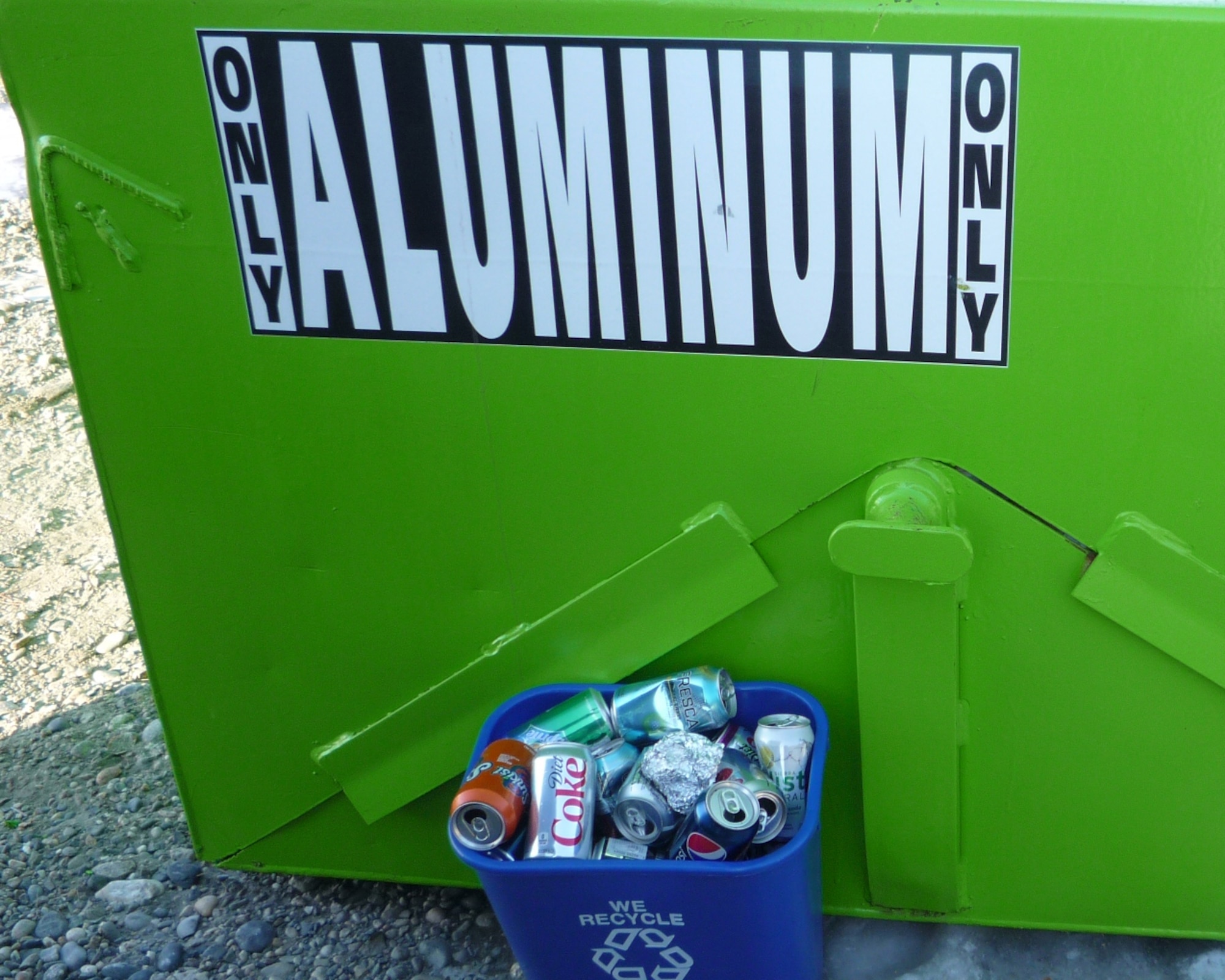 Aluminum cans go in the green collection dumpsters. Leave the cans uncrushed as they are easier to process and take them out of bags or boxes.  Only empty aluminum cans and clean regular aluminum foil are acceptable for this bin.  Other heavier aluminum items need to go into scrap metal bins.  (Courtesy photo)