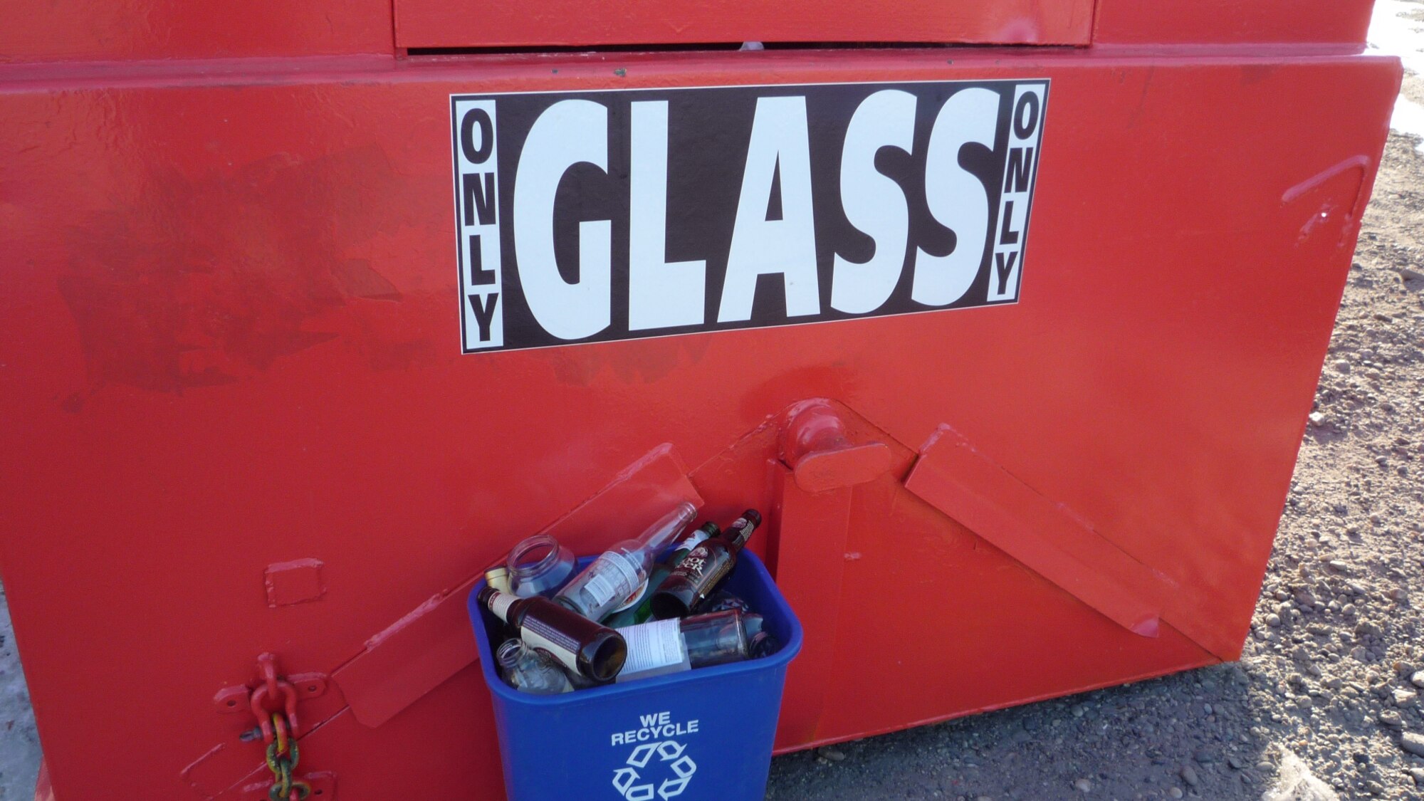 Glass bottles of all colors go in the red dumpsters. Remove lids and recycle them separately.  Window glass, plate glass, ceramics, porcelain, dishes, cookware or anything other than regular glass drinking bottles should go in this dumpster. (Courtesy photo)