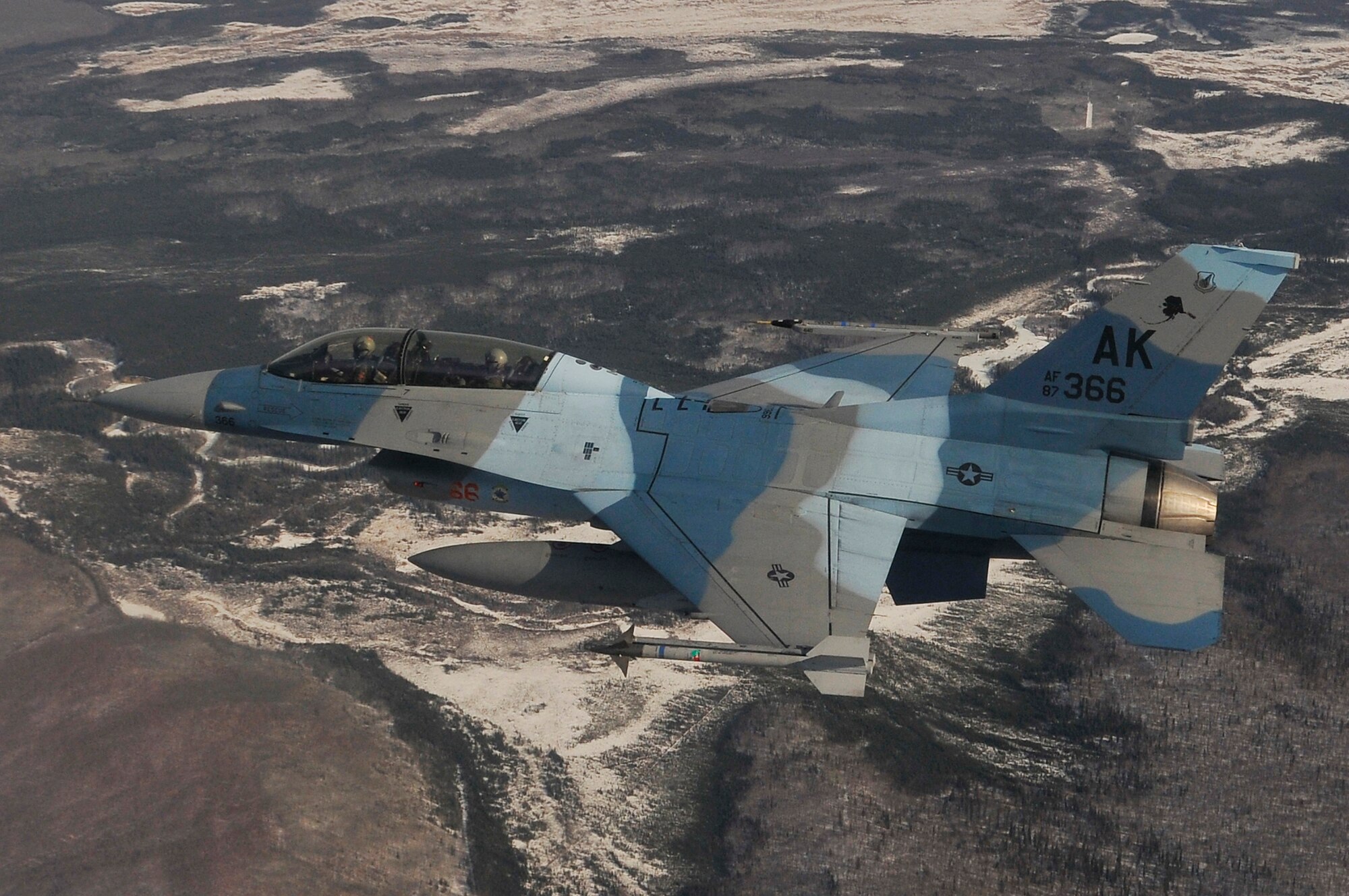 An F-16 Fighting Falcon Aggressor passes over the Joint Pacific Alaska Range Complex during RED FLAG-Alaska April 18, 2011, Eielson Air Force Base, Alaska. RED FLAG-Alaska enables aviation units to sharpen combat skills by flying ten simulated combat sorties in a realistic threat environment. Additionally, the training allows units to exchange tactics and techniques to improve interoperability. The F-16 is assigned to the 18th Aggressor Squadron. (U.S. Air Force photo/Staff Sgt. Christopher Boitz)