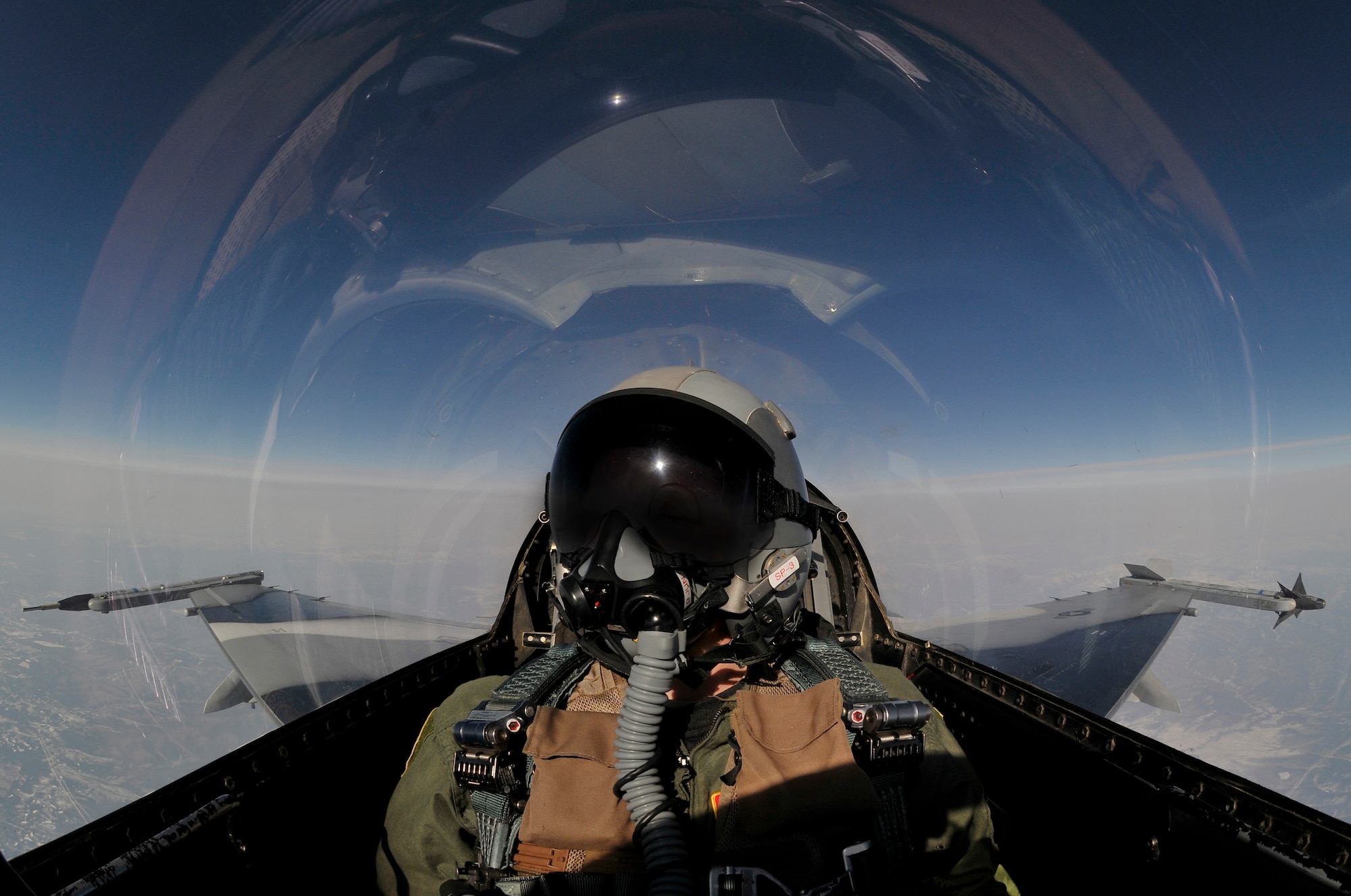 An aircrew member flies a simulated combat sortie over the Joint Pacific Alaska Range Complex in an F-16 Fighting Falcon during RED FLAG-Alaska April 18, 2011, Eielson Air Force Base, Alaska. RED FLAG-Alaska enables aviation units to sharpen combat skills by flying ten simulated combat sorties in a realistic threat environment. Additionally, the training allows units to exchange tactics and techniques to improve interoperability. The F-16 Aggressor is assigned to the 18th Aggressor Squadron. (U.S. Air Force photo/Staff Sgt. Christopher Boitz)