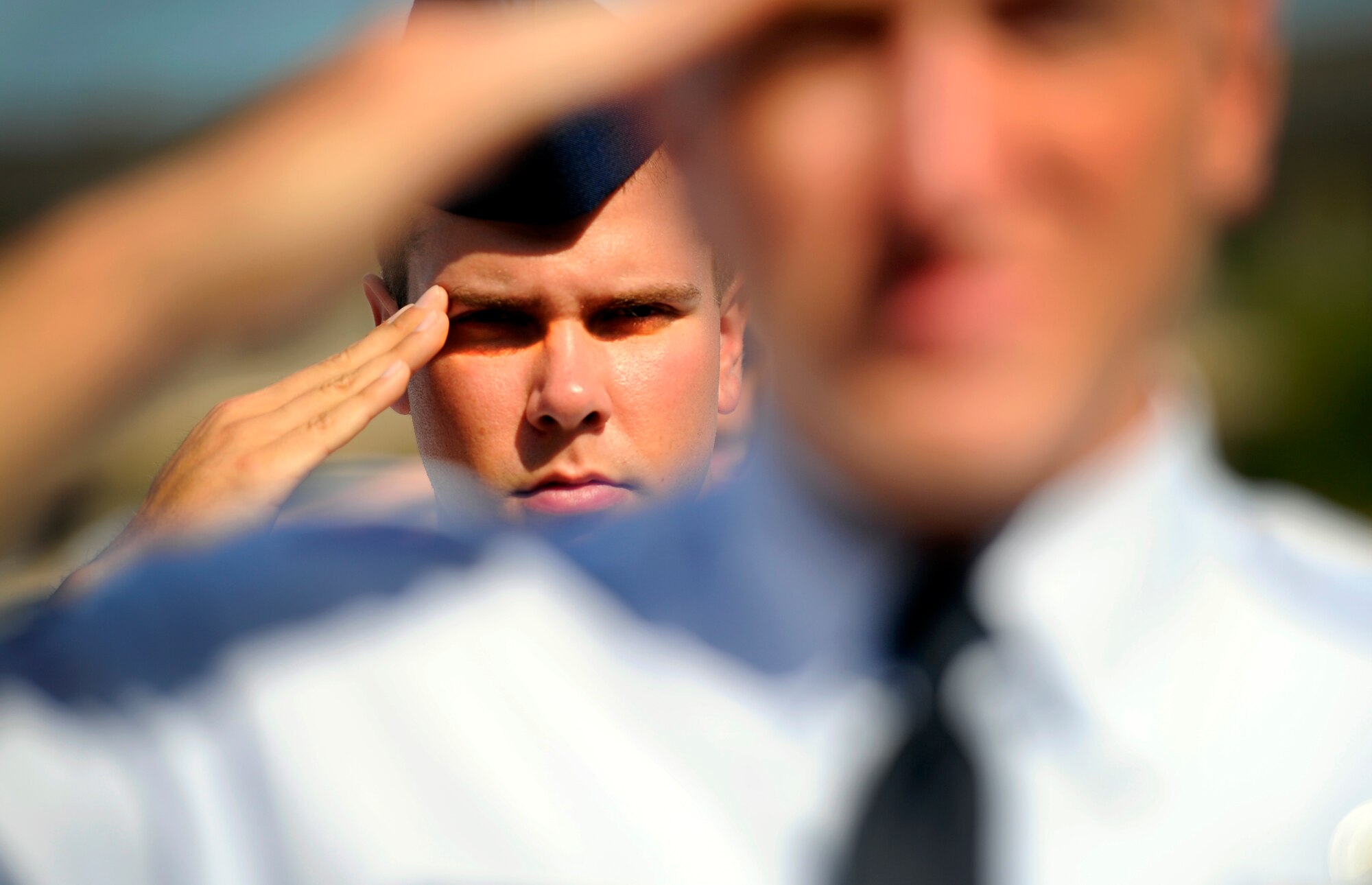 Senior Airman Matthew Connolly, 801st Special Operations Aircraft Maintenance Squadron, salutes during an Airman Leadership School memorial ceremony for Airman 1st Class John Vincent, April 18, 2011 at Hurlburt Field, Florida. Airman Vincent was killed by lightning 15 years ago while working on the flight line here. Hurlburt Field's ALS is named after Airman Vincent.  (U.S. Air Force photo by Senior Airman David Salanitri/Released) 
