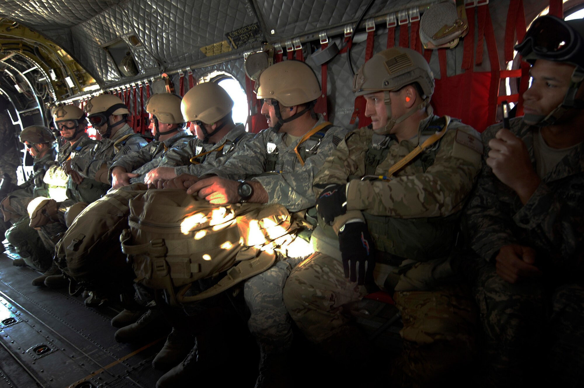 NELLIS AIR FORCE BASE, Nev. -- Air Force jumpers from the 820th Airborne RED HORSE from Nellis fly to a landing zone prior to a static line jump on April 15. Airborne RED HORSE are significantly different than the rest of traditional RED HORSE in that members are airborne qualified and use much lighter specialized equipment. (U.S. Air Force photo by Master Sgt. Kevin J. Gruenwald)