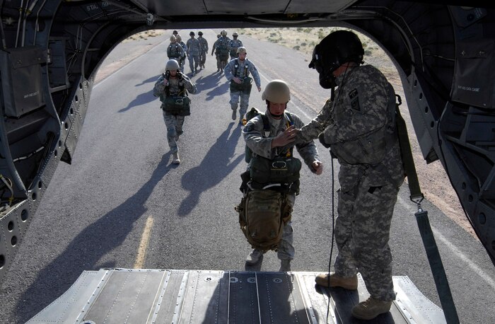 NELLIS AIR FORCE BASE, Nev. -- Air Force jumpers from the 820th RED HORSE squadron, airborne flight, board a CH-47 Chinook helicopter on April 15. Airborne RED HORSE are significantly different than the rest of traditional RED HORSE in that members are airborne qualified and use much lighter specialized equipment. (U.S. Air Force photo by Master Sgt. Kevin J. Gruenwald)