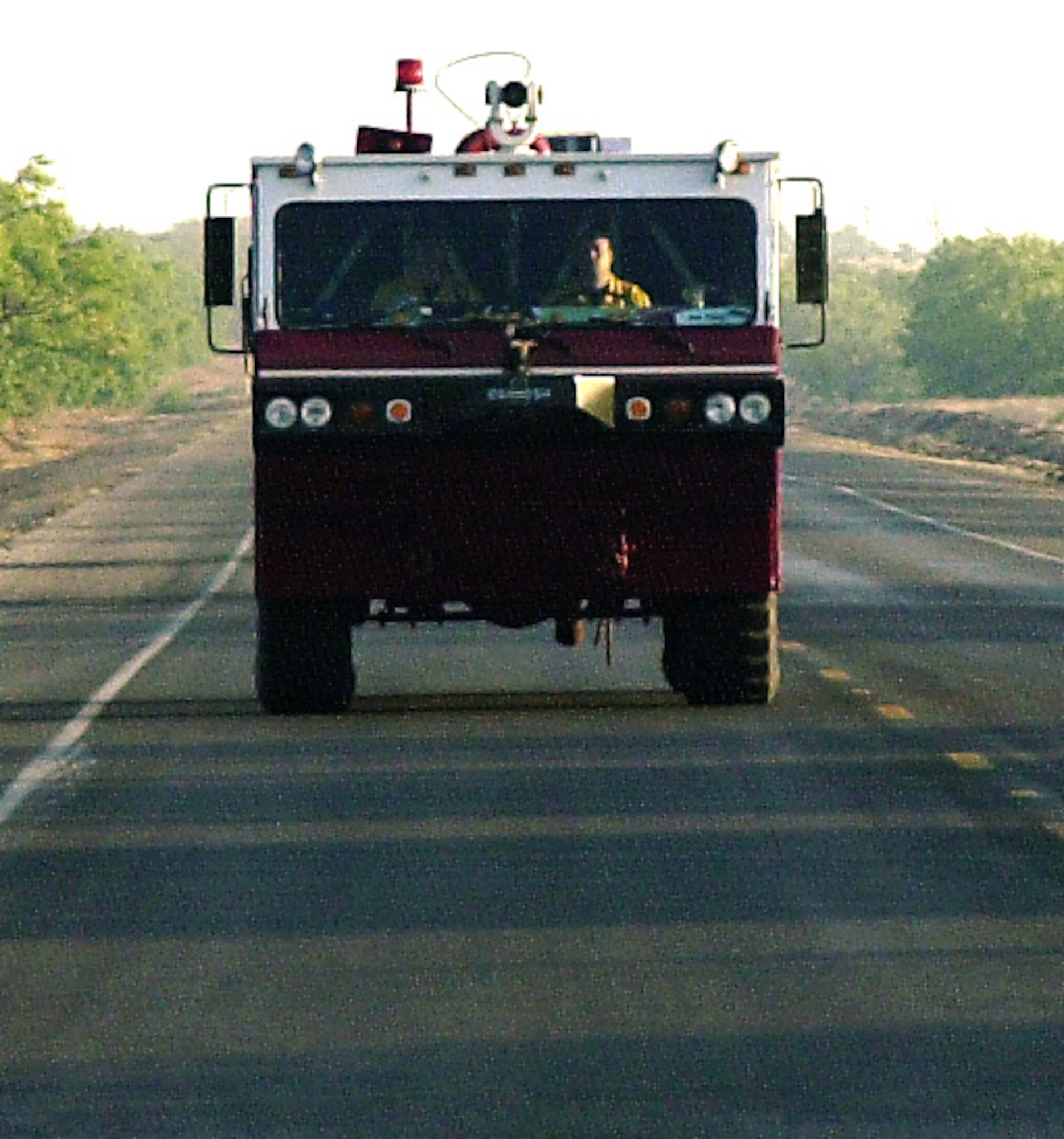 COKE COUNTY, Texas -- Two Louis F. Garland Fire Academy instructors head back to Goodfellow Air Force Base, Texas, in a P-19 after pulling a 12-hour night shift battling part of the Wildcat fire April 19 off of U.S. Highway 277. Five P-19s from the academy, each holding 1,000 gallons of water, have been used to battle the Wildcat blaze which has burned more than 150,000 acres so far. Eight academy instructors and two Goodfellow firefighters have teamed up with hundreds of surrounding firefighters to keep the fire from taking lives and homes. (U.S. Air Force photos/Connie Hempel)