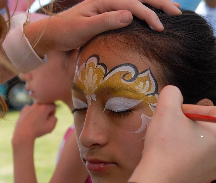 Brianna Quijano, 11, gets her face painted during the Luke Air Force Base Spring Fest held at Fowler Park April 16. (U.S. Air Force photo by Senior Airman Darlene Seltmann)