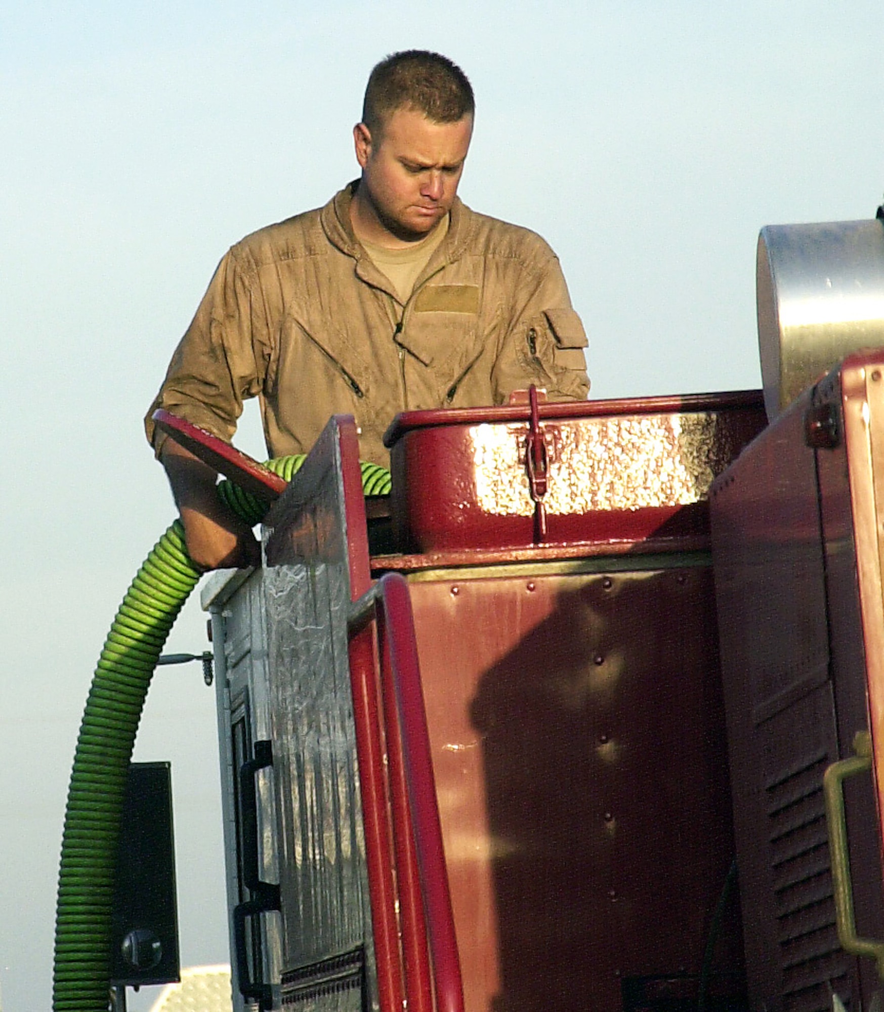 COKE COUNTY, Texas -- Staff Sgt. Jacob Wagner, Louis F. Garland Fire Academy instructor, refills one of the five P-19s from the academy used to battle the Wildcat blaze April 19.  Each P-19 holds 1,000 gallons of water.  Sergeant Deese is one of eight academy instructors that have teamed up with Goodfellow and surrounding firefighters to keep the fire from taking lives and homes. (U.S. Air Force photos/Connie Hempel)