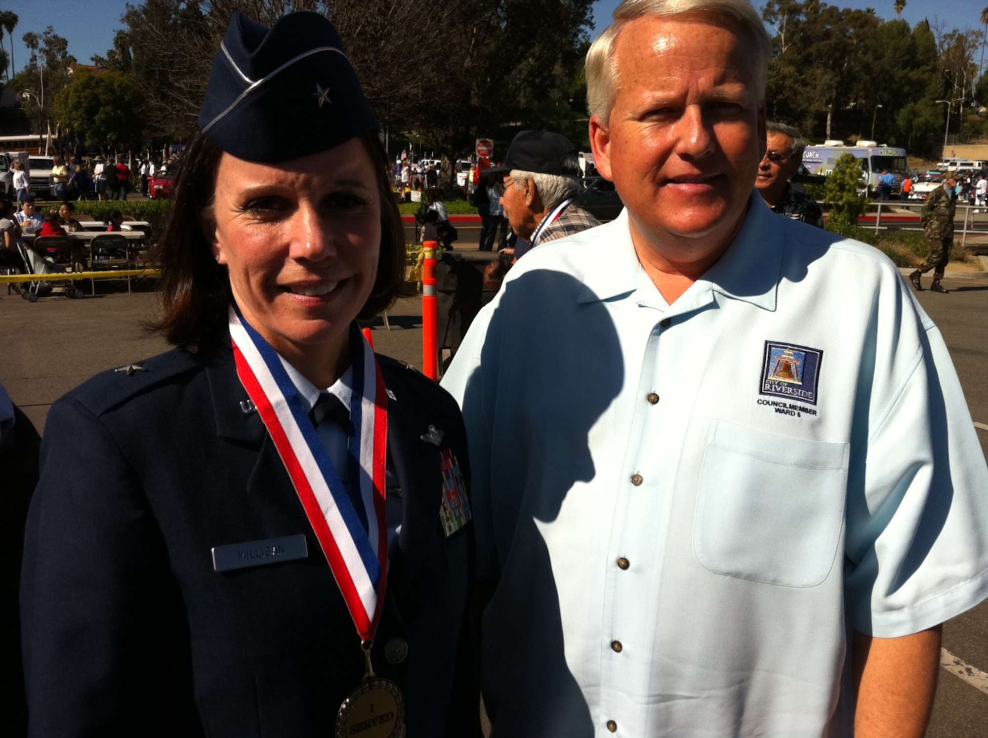 Brig. Gen. Pamela Milligan, Vice-Commander, 4th Air Force, Air Force Reserve Command, March Air Reserve Base, Calif., poses with Riverside City Councilman Chris MacArthur at the 6th annual "Salute to Veterans Parade" in downtown Riverside, Calif., April 16, 2011.  General Milligan was a member of the reviewing party during the 132-unit parade, which was themed "Honoring Those Who Have Sacrificed" and featured participants from military units from across southern California. 