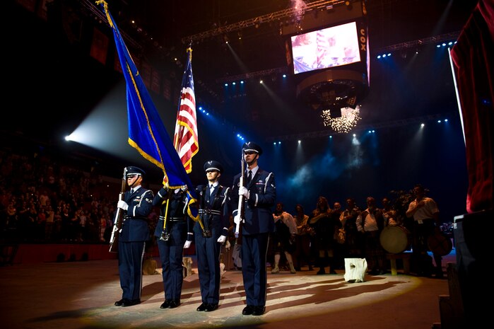 LAS VEGAS --  Nellis Honor Guard presents the colors during the national anthem at the International Tattoo in the Thomas & Mack Center April 15. The international tattoo is a show celebrating the contribution of America's armed forces. (U.S. Air Force photo by Senior Airman Brett Clashman)