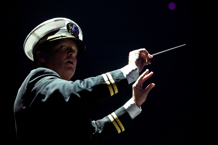 LAS VEGAS -- A U.S. Navy conductor directs the Navy Band Southwest during the International Tattoo at the Thomas & Mack Center, April 15. The international tattoo is a show celebrating the contribution of America's armed forces. (U.S. Air Force photo by Airman 1st Class Matthew Lancaster)