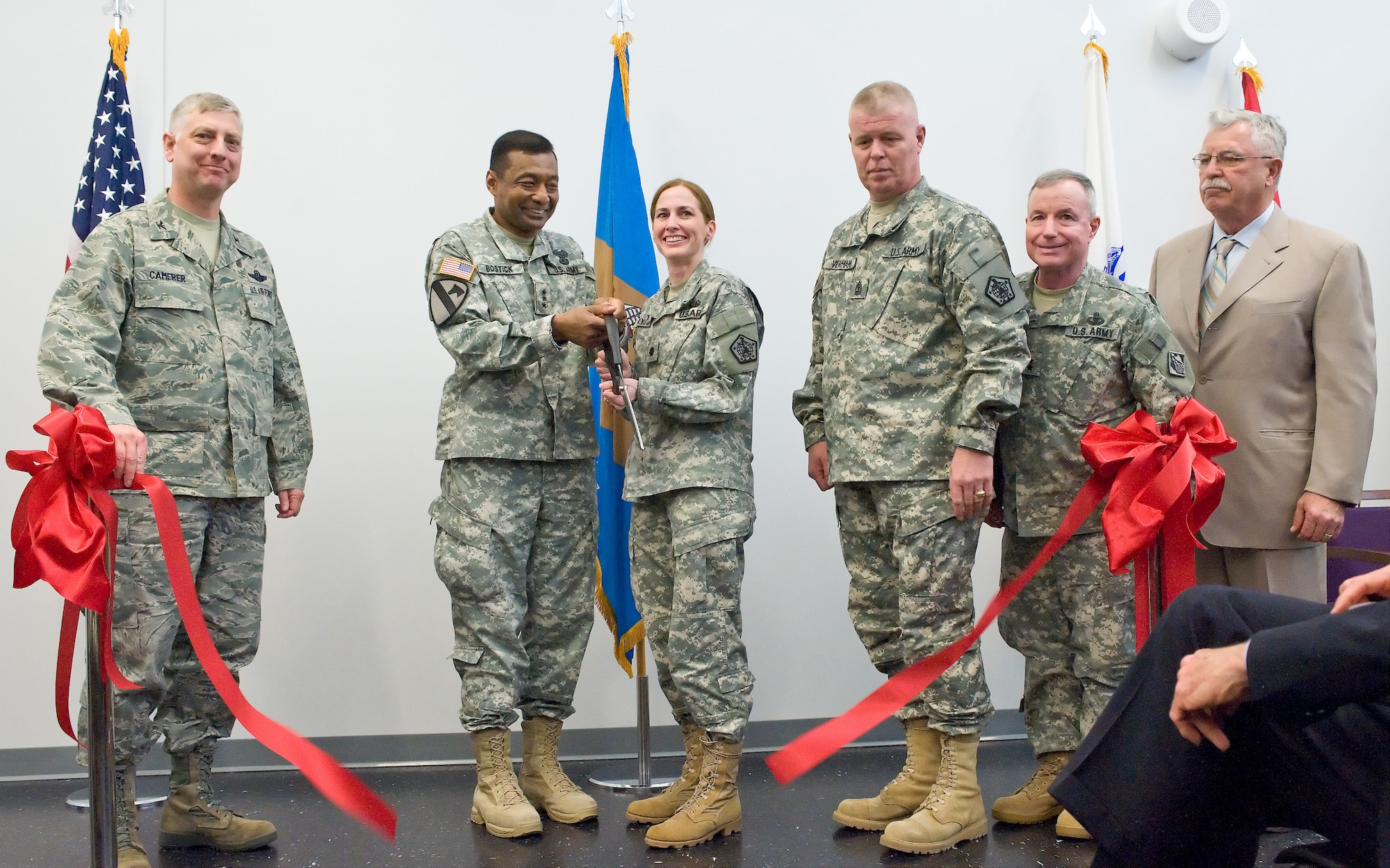 Col. Mark Camerer, left, Lt. Gen. Thomas Bostick, Lt. Col. Kelly Kyburz, 1st Sgt.  Alfred Venham, Maj. Gen. Bo Temple and Mr. Stephen Mockbee stand for the ribbon cutting, April 14, 2011, signaling the opening of the Joint Personal Effects Depot at Dover Air Force Base, Del. (U.S. Air Force photo by Roland Balik)