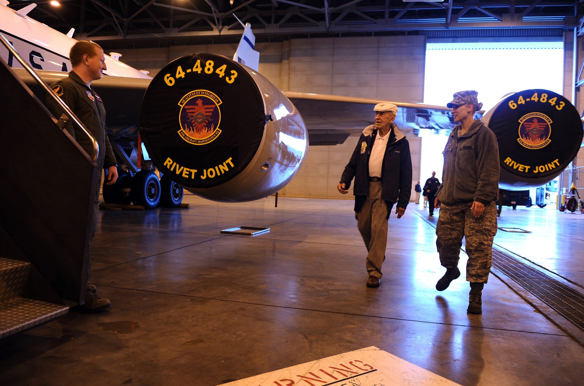 OFFUTT AIR FORCE BASE, Neb. -- Doolittle Raider Richard Cole, who was a co-pilot on crew 1 for Lt. Col. James H. "Jimmy" Doolittle, tours a static RC-135V/W Rivet Joint as Senior Airman Shana Delgado, 55th Wing protocol, welcomes him to base April 15. The five surviving Doolittle Raiders were here as part of their 69th annual reunion, which took place this year in Nebraska from April 14-17. (Air Force photo by Josh Plueger)