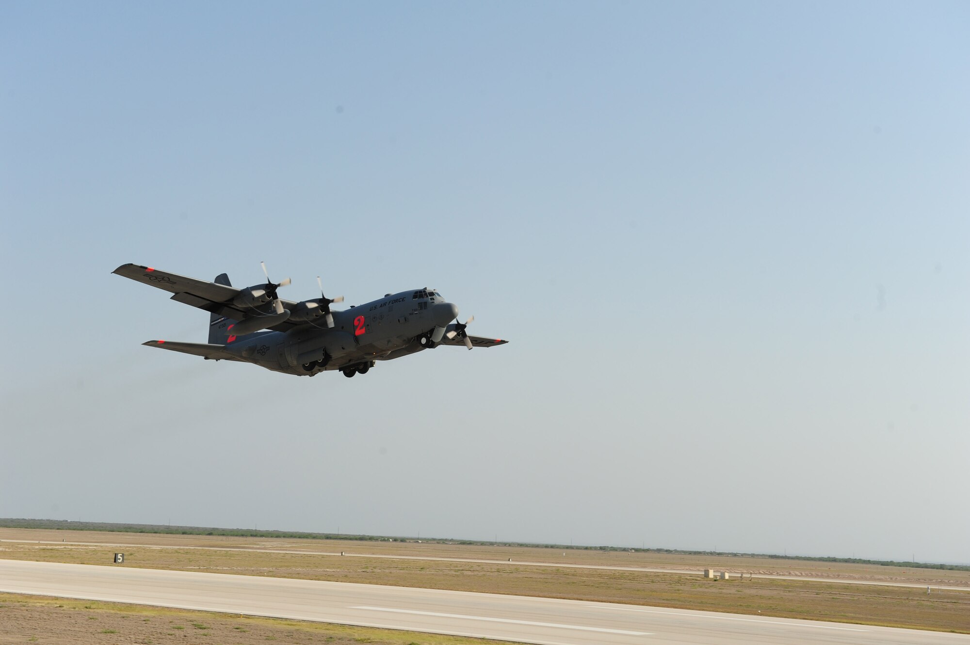 LAUGHLIN AIR FORCE BASE, Texas: A C-130 equipped with a U.S.D.A. Forest Service Modular Airborne Fire Fighting System departs April 17 to fight a wildfire in a neighborhood in Austin, Texas, April 17. U.S. Northern Command has deployed six C-130 aircraft fitted with MAFFS to support the battle against ongoing wildfires in the area. (U.S. Air Force photo by Staff Sgt. Quinton Russ) 