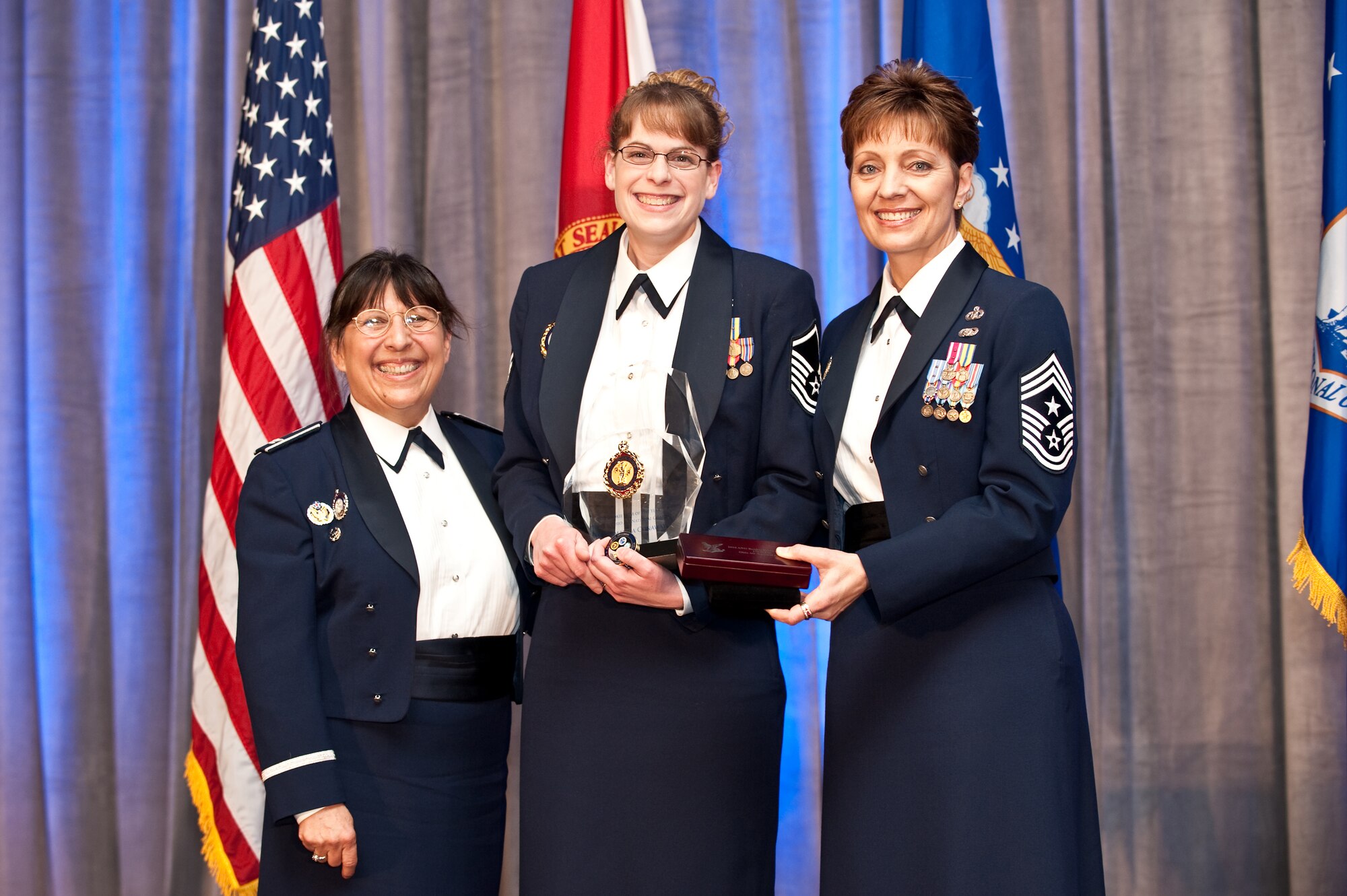 Master Sgt. Amanda Conaway,178th Fighter Wing Retention Office Mangager, receives  Rookie Retention Office Manager of the Yearaward from Col. Mary Alice Salcido, Director, ANG Recruiting and Retention, and Chief Master Sgt. Denise Jelinski-Hall, Senior Enlisted Leader for the National Guard. Bureau March 29.  Master Sgt. Conaway was selected from candidates from all the 54 states and territories.