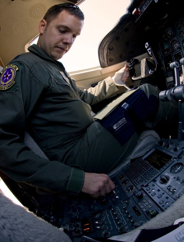 Captain Chris Purvis, 457th Airlift Squadron pilot performs pre-flight operations inside a squadron C-21 aircraft prior to flying a mission April 15. The 457 AS is a tenant squadron under the Air Mobility Command, 375th Airlift Wing at Scott Air Force Base, Ill. The squadron operates C-21 aircraft and provides executive airlift. (Photo by Bobby Jones)