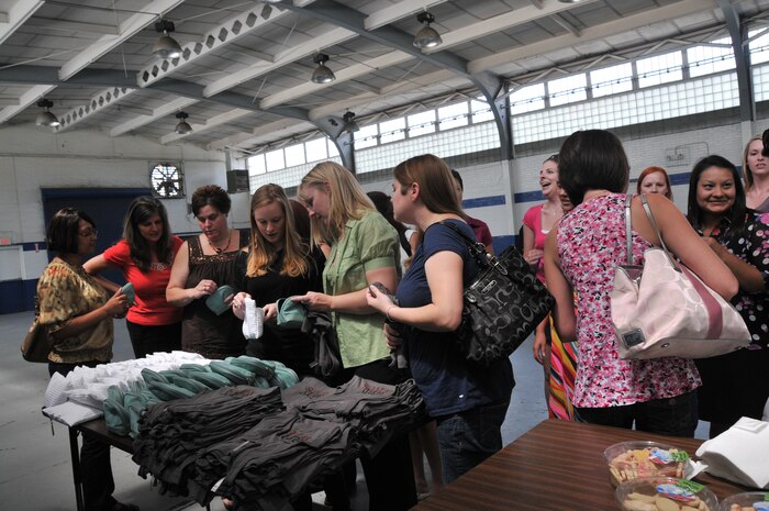 More than 50 military spouses wait in line to receive free make-up supplies and shirts courtesy of the TV show ‘Army Wives’ during a military wives make over April 19, at Armory Park in North Charleston, S.C. (U.S. Air Force photo /A1C Jared Trimarchi)
