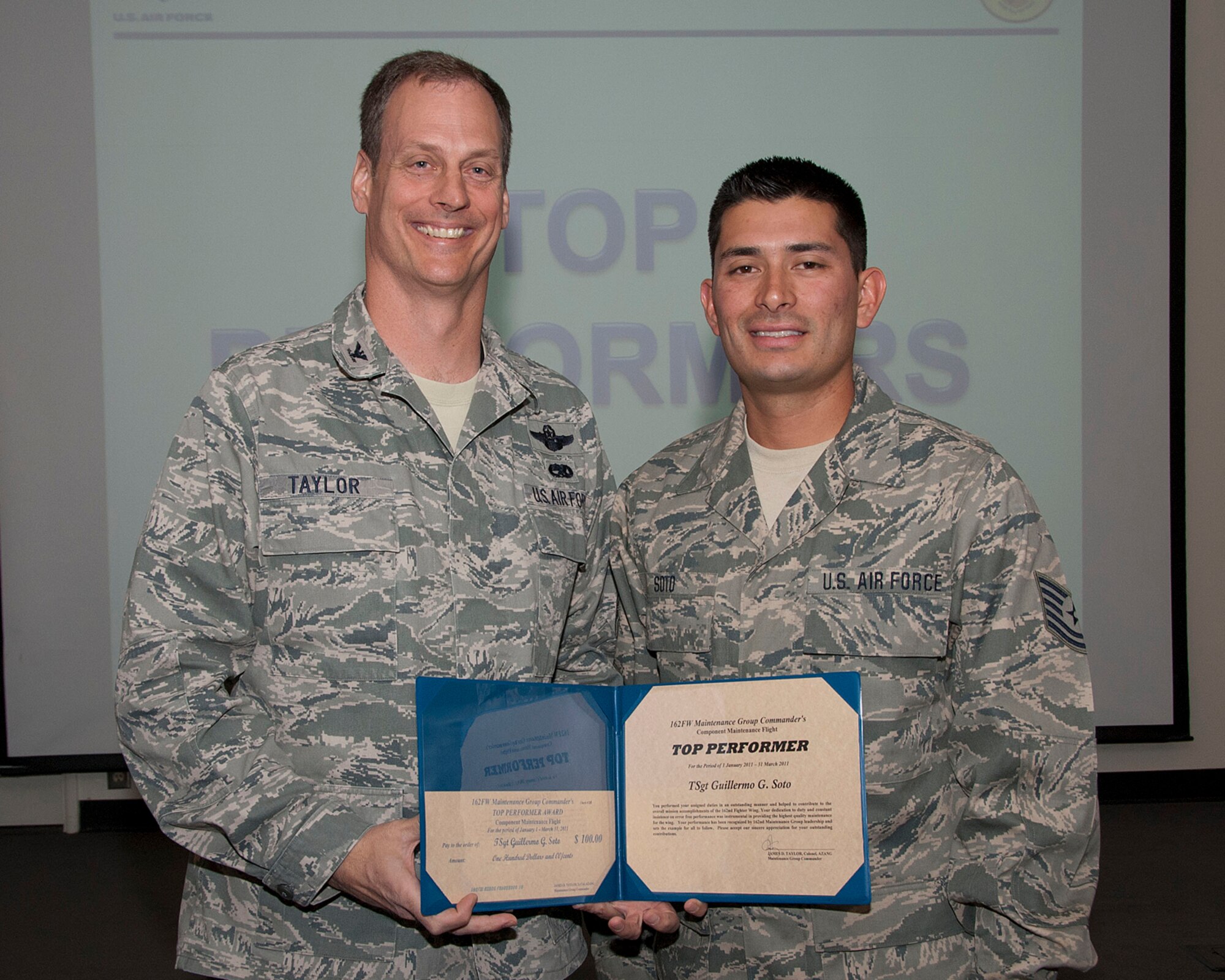Col. James Taylor (left) presents Tech. Sgt. Guillermo G. Soto the Top Performers Award for his work with the Component Maintenance Flight.  (U.S. Air Force photo/Master Sgt. David Neve)