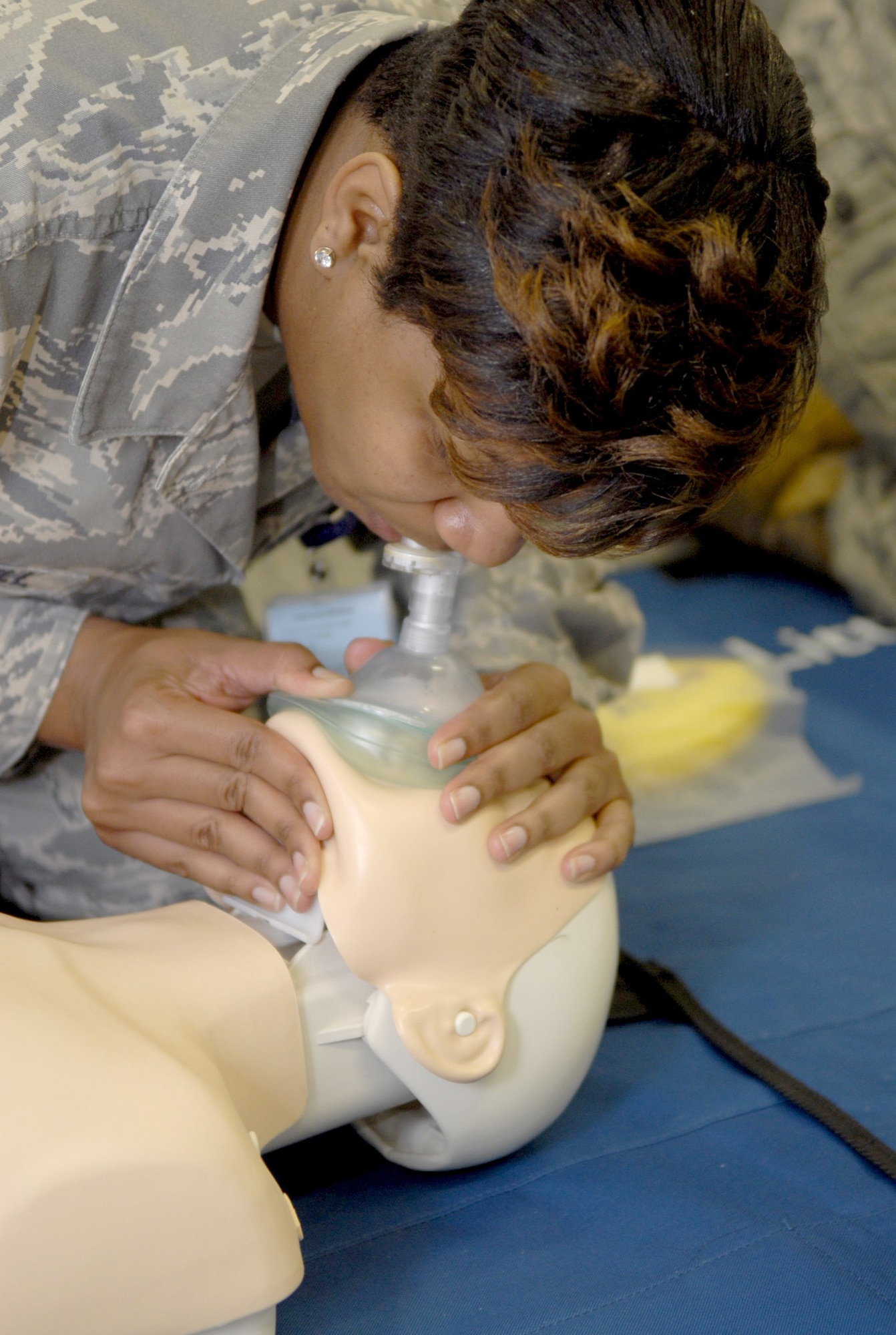 Tech. Sgt. Nicole Caldwell practices giving breaths to a CPR dummy April 15, 2011, during a Heartsaver class at Kadena Air Base, Japan. The American Heart Association has updated the CPR technique with the more effective method of administering immediate chest compressions. (U.S. Air Force photo/Airman 1st Class Tara A. Williamson)