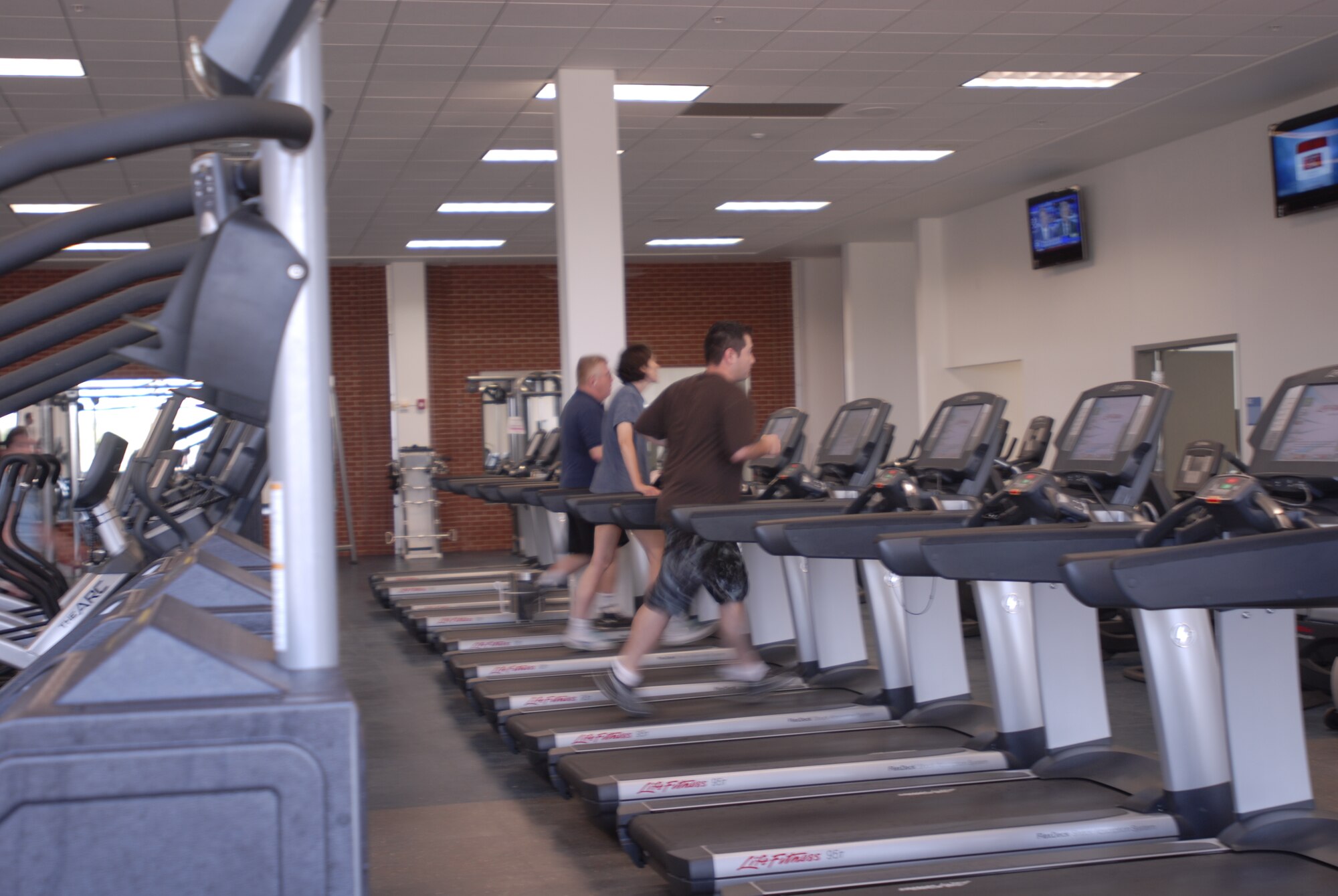 GOODFELLOW AIR FORCE BASE, Texas—Customers take advantage of some of the new equipment at the Mathis Fitness Center, April 19.  During the center’s recent expansion, which gave an additional 15,000 square feet to the center, 142 new pieces of equipment, including various cardio and strength training machines, were added. (U.S. Air Force photo/Airman 1st Class Jessica Keith)