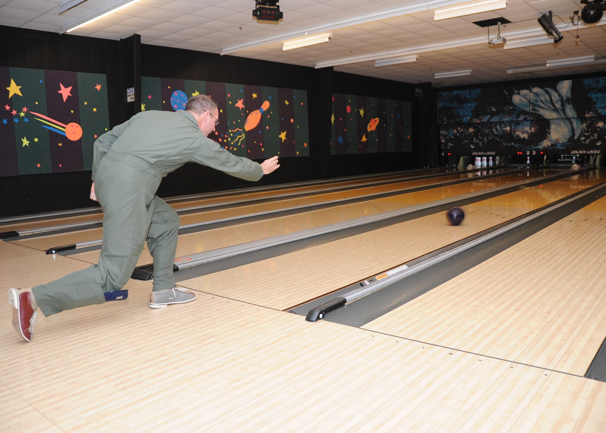 ALTUS AIR FORCE BASE, Okla. – Col. Jon T. Thomas, 97th Air Mobility Wing commander, bowls at the Galaxy Lanes Bowling Alley during the top three bowl-a-thon April 15. The top three bowl-a-thon raised money in support of the Air Force Assistance Fund. (U.S. Air Force photo by Airman 1st Class Christopher Toon/97th Air Mobility Wing-Public Affairs)