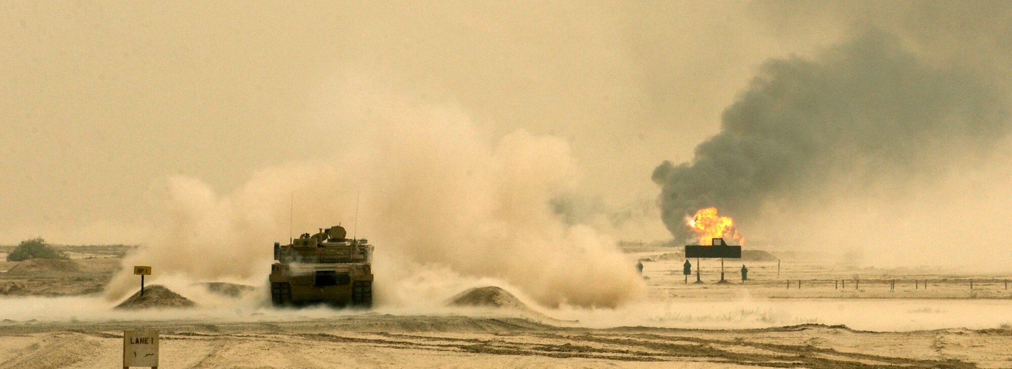 BESMAYA RANGE COMPLEX, Iraq - An Iraqi M1A1 Abrams tank from the Iraqi Ground Forces Command, Ninth Mechanized Infantry Division, fires a round into the target area during a joint demonstration near Baghdad April 18. The exhibition was just one of several ongoing, multi-phase exercises designed to further integrate the Iraqi air force, Iraqi Army Aviation Command and Iraqi army. (U.S. Air Force photo by Tech. Sgt. Randy Redman)