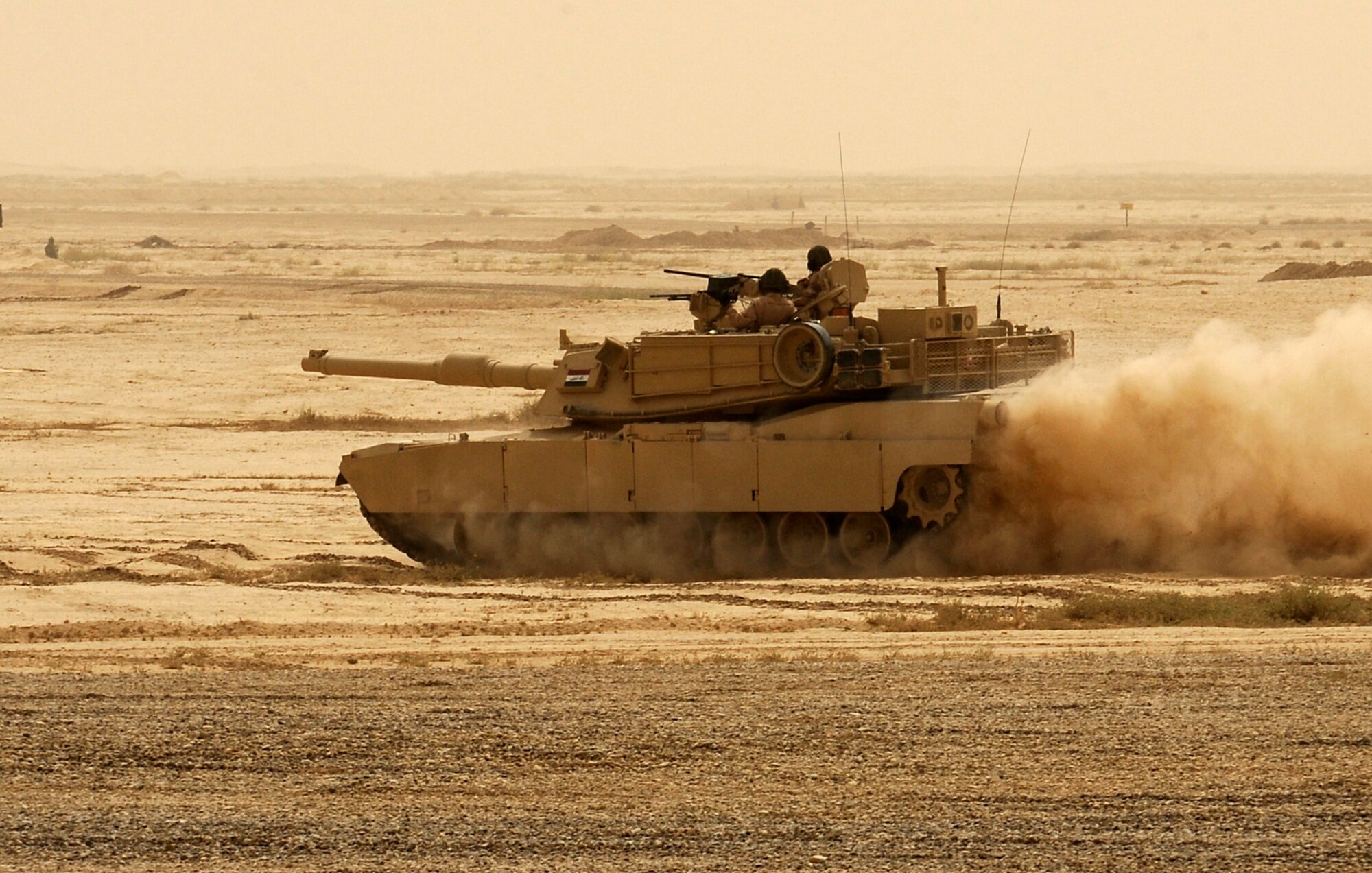 BESMAYA RANGE COMPLEX, Iraq – An Iraqi M1A1 Abrams tank from the Iraqi Ground Forces Command, Ninth Mechanized Infantry Division, charges into the fray during a joint demonstration near Baghdad April 18. The exhibition was just one of several ongoing, multi-phase exercises designed to further integrate the Iraqi air force, Iraqi Army Aviation Command and Iraqi army. (U.S. Air Force photo by Tech. Sgt. Randy Redman)