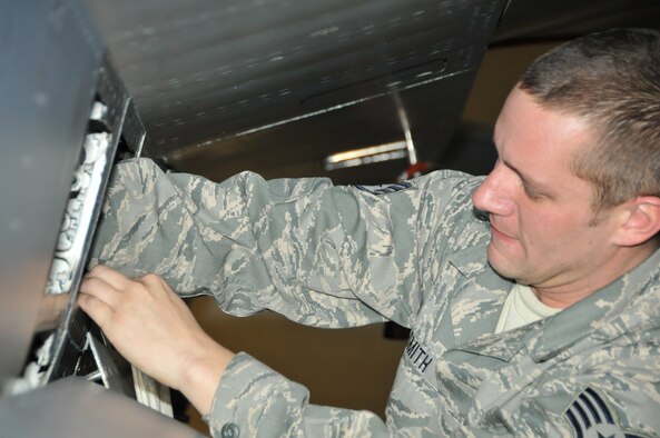 Staff Sgt. Stephen Smith performs maintenance radar
upgrades on a F-16 Fighting Falcon.