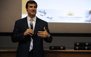 Mr. Pat Crain, Imagine Schools Maryland Regional director, addresses members of the Joint Base Andrews community at the Imagine Andrews Charter School town hall meeting at the base theater April 14. The meeting offered the families of children accepted into the school an opportunity to ask school officials questions on a wide range of topics including school uniforms, hiring process for teachers, enrollment procedures and school hours.