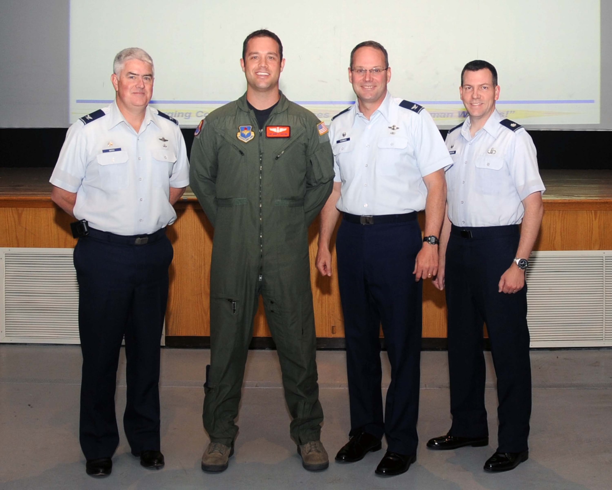 ALTUS AIR FORCE BASE, OKLA.— Col. Odie Oates, 97th Operations Group commander, Col. Ty Thomas, 97th Air Mobility Wing commander, and Lt. Col. Steve Johnson, 97th Operations Support Squadron commander, stand with Staff Sgt. Marc Safford, 97th OSS, as he is named one of the team members for the 97th AMW Rodeo Red River Riders Joint Airdrop Inspection Team for the 2011 Air Mobility Command Rodeo.  The AMC Rodeo is a mobility rodeo competition between units from around the world that will be held at Joint Base Lewis-McChord, Wash. July 23-30. From the 97th Operations Support Squadron, Staff Sgt. Safford and Tech. Sgt. Jeff Austin will be competing in the static airdrop load inspection, conduct all before-and after-loading inspections for unit airdrop missions and performance of their airdrop loads. (U.S. Air Force photo/Senior Airman Leandra D. Stepp)