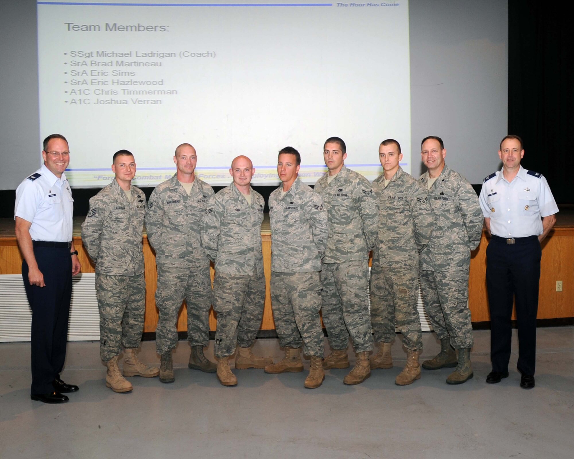 ALTUS AIR FORCE BASE, Okla.—Col. Jon T. Thomas, 97th Air Mobility Wing commander, and Col. James Peccia, 97th Mission Support Group commander, stand with the members of the 97th AMW Rodeo Red River Riders Aerial Port Team for the 2011 Air Mobility Command Rodeo.  The AMC Rodeo is a mobility rodeo competition between units from around the world that will be held at Joint Base Lewis-McChord, Wash. July 23-30. From the 97th Logistics Readiness Squadron, team coach, Staff Sgt. Michael Ladrigan and team members Senior Airmen Brad Martineau, Eric Sims, Eric Hazlewood, Airmen 1st Class Chris Timmerman and Joshua Verran, make up the Aerial Port team. The team will be competing in engine running on and off load, a challenge course with numerous events and a four-mile run, a joint inspection and more. (U.S. Air Force photo/Senior Airman Leandra D. Stepp)