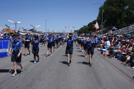 The Randolph High School Rohawks Marching Band, marches in the Battle of the Flowers Parade in San Antonio, as part of Fiesta April 15, 2011.  The band has an impressive record, to include Sweepstakes (#1 ratings) for University Interscholastic League concert, site reading and marching contests. They have also earned South Texas area champs for the last four years. Normally marching 110 band members, for this year's parade the band included seventh graders, taking the total to 150.(U.S. Air Force photo/Rich McFadden)