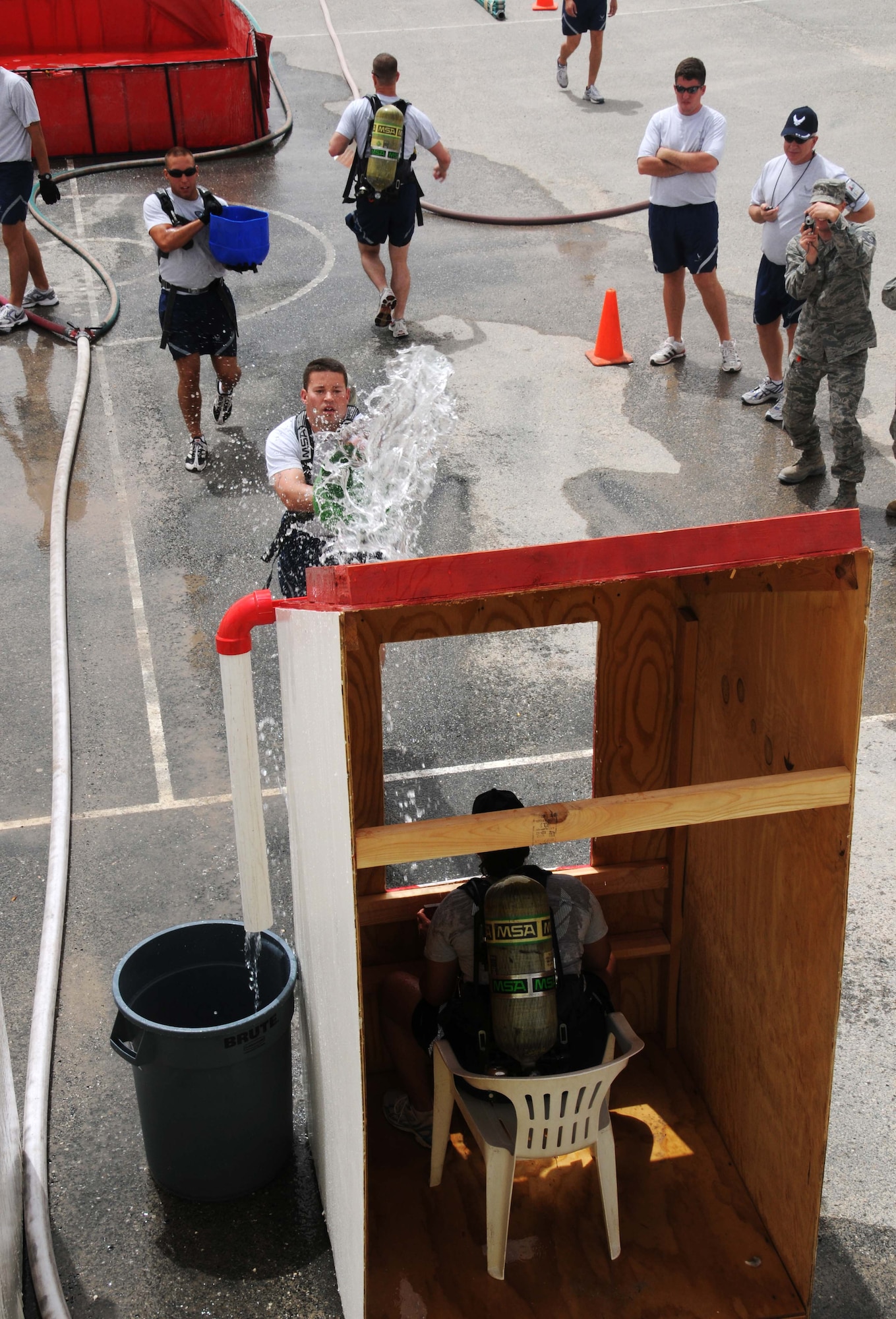 Airmen from the 379th Air Expeditionary Wing compete in the Fire Muster April 16 in Southwest Asia. The Fire Muster is an event that has many different stages where teams compete. The event is held by the 379th Expeditionary Civil Engineer Squadron. (U.S. Air Force photo/Staff Sgt Anthony Graham)
