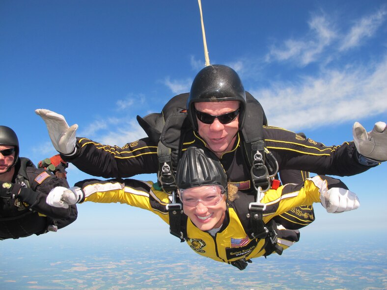 Senior Airman AnnTaylor Hand falls from the sky above Seymour Johnson with the U.S. Army's Golden Knights on Sunday, April 17. Airman Hand opened the Wings Over Wayne air show   (Courtesy photo by SSG Aaron Figel, Golden Knights)                 