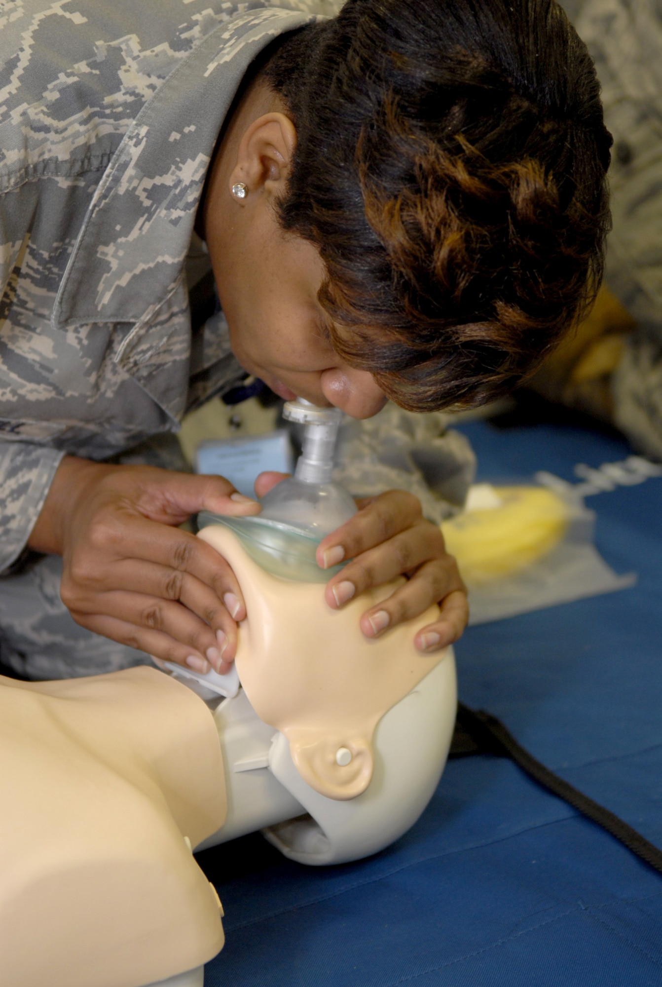 Tech. Sgt. Nicole Caldwell, noncommissioned officer in charge of the 18th Dental Squadron, practices giving breaths to a CPR dummy during a Heartsaver class at the 18th Medical Group here on Kadena Air Base, April 15. The American Heart Association has updated the CPR technique with the more effective method of administering immediate chest compressions. (U.S. Air Force photo/Airman 1st Class Tara A. Williamson)
