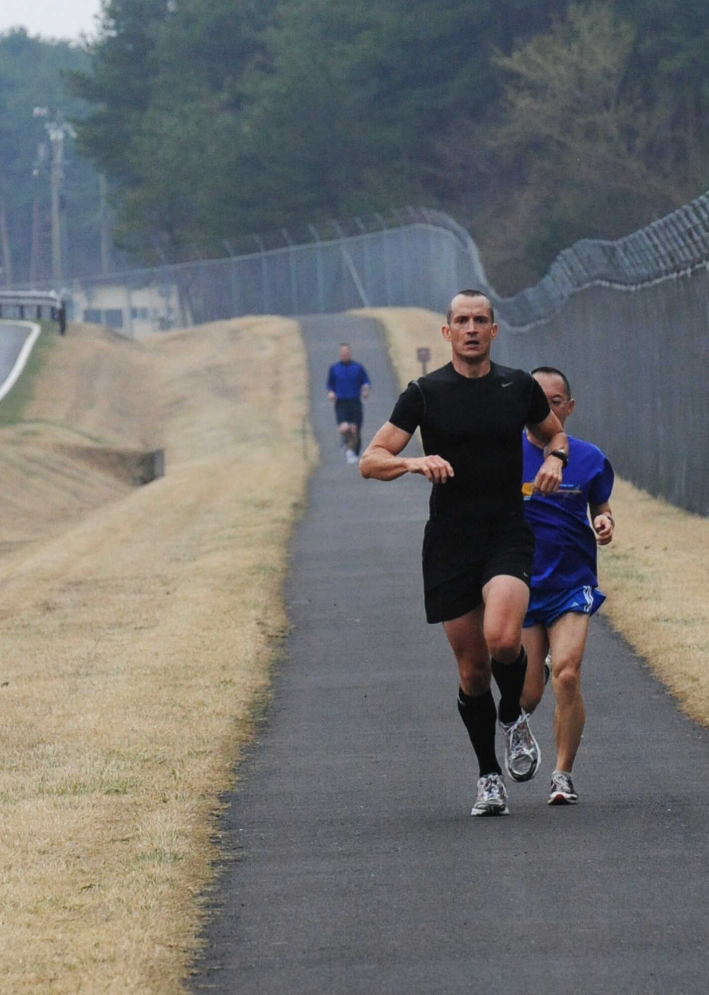 MISAWA AIR BASE, Japan ? Mr. Brian Miller, 35th Medical Group Military Family Life Consultant augmentee from Ft. Worth, Texas; takes the lead in the Sakura 5 Miler fun run 16 April.  Mr. Miller was the first to complete the 5 mile run in a time of 0:31:39.  (U.S. Air Force Photo by Staff Sgt. April Quintanilla/Released)