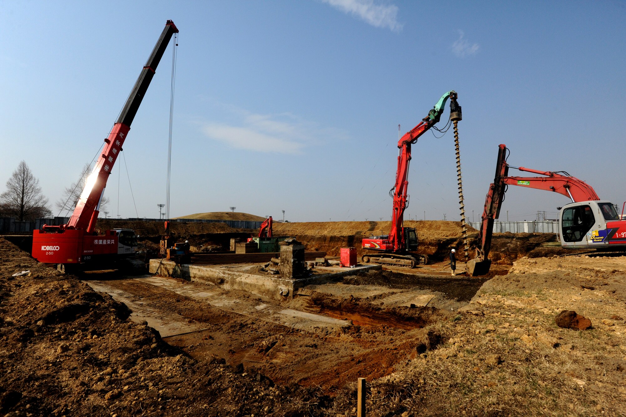 MISAWA AIR BASE, Japan -- Contractors with the 35th Civil Engineer Squadron, remove a 158,000 gallon sewage tank from the sports field behind Edgen High School 14 April.  The cost of the sewage tank removal was estimated at $115,000 and is scheduled to be completed 31 May 2011. (U.S. Air Force Photo by Staff Sgt. April Quintanilla/Released)