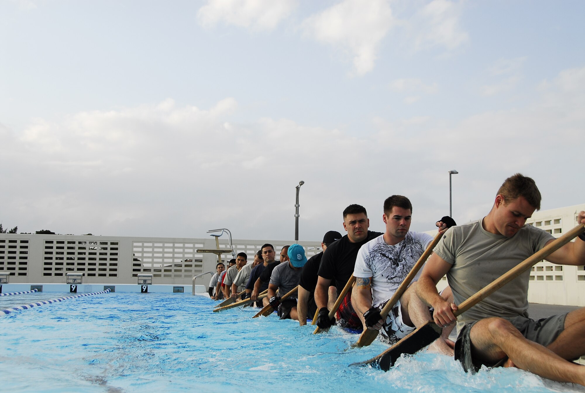 The men of Kadena’s Dragon Boat racing team spend their afternoons practicing for the upcoming race at Kadena’s Fairchild pool, April 5. The Dragon Boat race can be traced back to the 13th century in China. A war hero named Kitsugen committed suicide after being falsely accused of betraying the Emperor. Once the Emperor found out about the incident he held a Dragon Boat race in his honor. (U.S. Air Force photo/ Airman 1st Class Maeson L. Elleman)