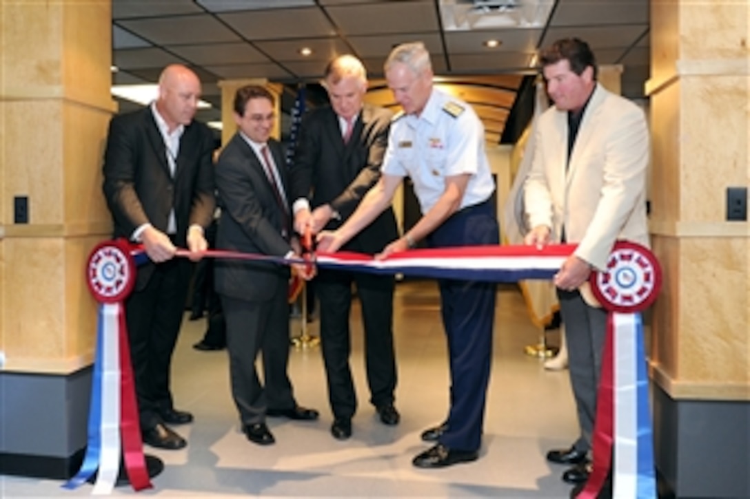 Deputy Assistant Secretary of Defense for Counternarcotics and Global Threats William F. Wechsler (2nd from left), Deputy Secretary of Defense William J. Lynn III, (3rd from left) and Joint Interagency Task Force South Commander Rear Adm. Daniel Lloyd conduct a ribbon cutting for the new Joint Operations Command Center at the Joint Interagency Task Force headquarters in Key West, Fla., on April 18, 2011.  