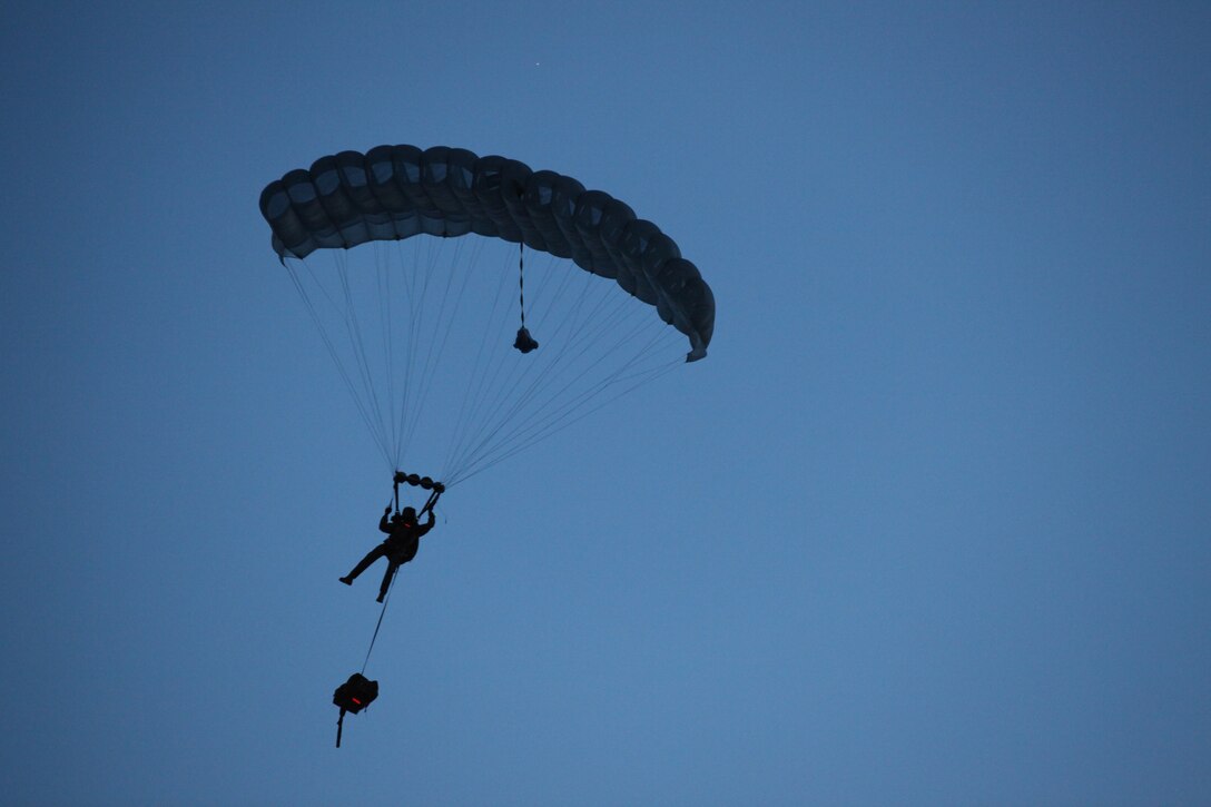 A Marine with 3rd Marine Special Operations Battalion, U.S. Marine Corps Forces, Special Operations Command, conducts a High Altitude, High Opening jump at dusk as part of a Double-Bag Static-Line parachute course in Wendover, Utah, April 9 - 21. The course was taught by personnel from the 2nd MSOB paraloft and the Airborne Mobile Training Team, and is designed to give Marines a basic understanding of HAHO operations.