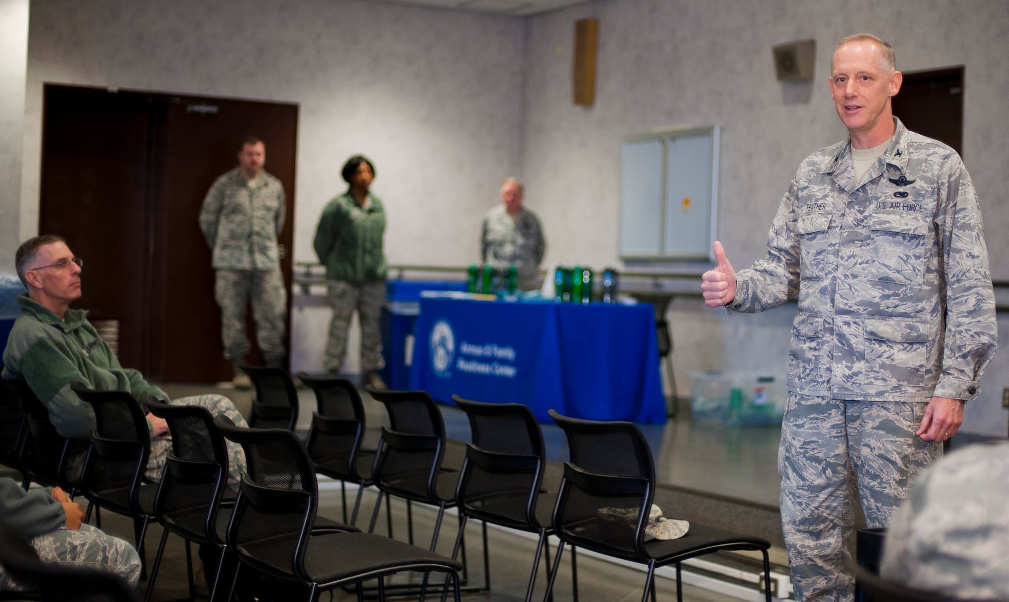 YOKOTA AIR BASE, Japan -- Col. Otto Feather, 374th Airlift Wing commander, speaks to families at a ReStart briefing at the Airman & Family Readiness Center here April 21.  ReStart is designed to help families that left during the voluntary authorized departure in-process with the base after returning. (U.S. Air Force photo/Staff Sgt. Chad C. Strohmeyer)