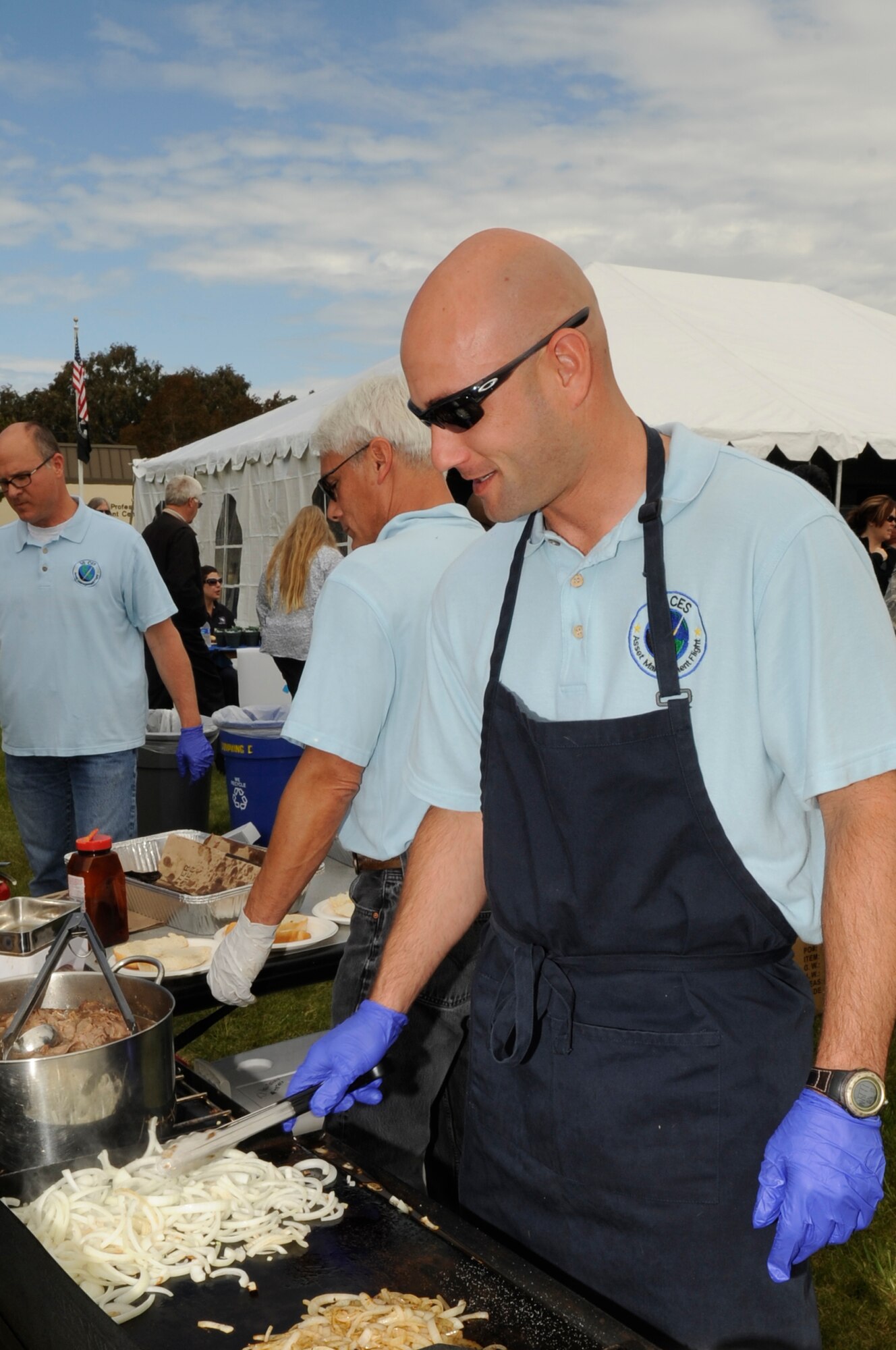 VANDENBERG AIR FORCE BASE, Calif. –Ben Roope and David Savinsky, both of the 30th Civil Engineer Squadron, cook at the Earth Day event at the Base Exchange complex here Wednesday, April 20, 2011. The 30th Civil Engineer Squadron hosted the event that showcases Vandenberg and the surrounding area’s efforts to be “green.” (U.S. Air Force photo/Senior Airman Lael Huss)