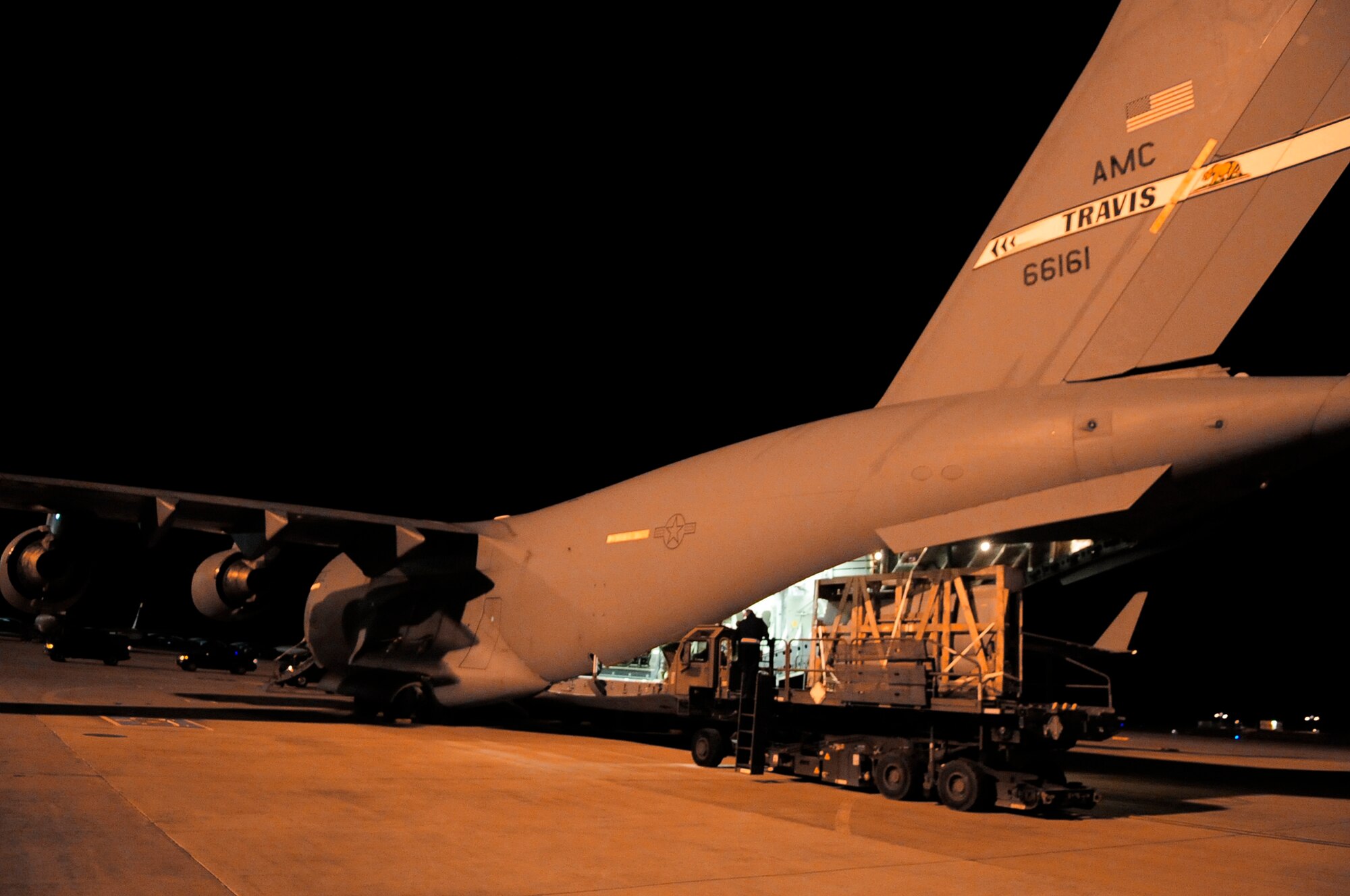 Airmen unload a pallet from a C-17 Globemaster III March 28, 2011, in support of Operation Odyssey Dawn. (U.S. Air Force photo/Senior Airman Ethan Morgan)