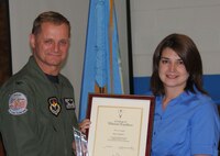 Amy Cummins, right, receives the 2011 Vance Volunteer of the Year award from Col. Russ Mack, 71st Flying Training Wing commander, during a ceremony held April 14 at Eisenhower Elementary School on Vance AFB, Okla. (U.S. Air Force photo/ 2nd Lt. Kiersten Thompson)