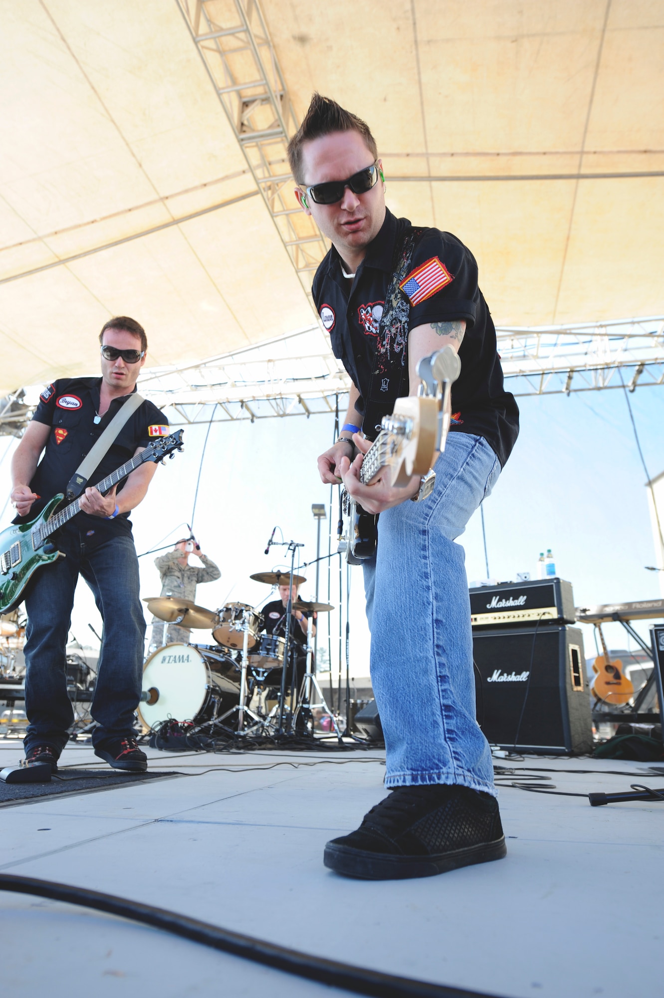 SEYMOUR JOHNSON AIR FORCE BASE, N.C. -- Aaron Harris and Bryan Duffy of the Garage Boys Band, a rock band based out of Las Vegas, Nev., perform for spectators during the Wings Over Wayne Air show and Open House here, April 17, 2011. The band performs all over the main Vegas strip as well as the Fremont Street strip. The boys also performed in parts of Arizona, California and Alaska. (U.S. Air Force photo/Tech. Sgt. Colette M. Graham) (RELEASED)