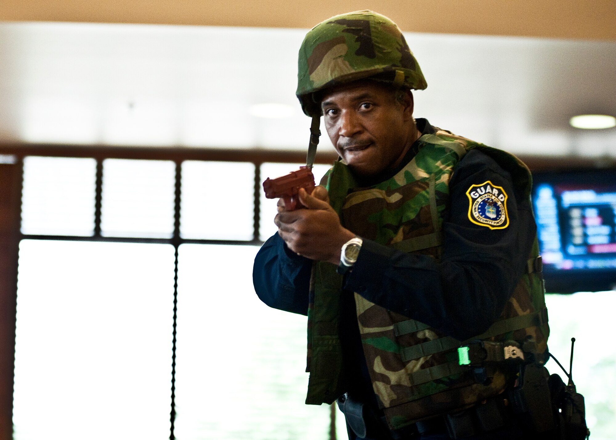 Officer Jonathan King, 96th Security Forces Squadron, enters the dining facility first in search of the “suspects” during an active shooter exercise at Eglin Air Force Base, Fla., April 20.  Security Forces personnel entered the facility where two “shooters” were holding hostages.  They quickly subdued or killed the “shooters” and evacuated the hostages.  (U.S. Air Force photo/Samuel King Jr.)