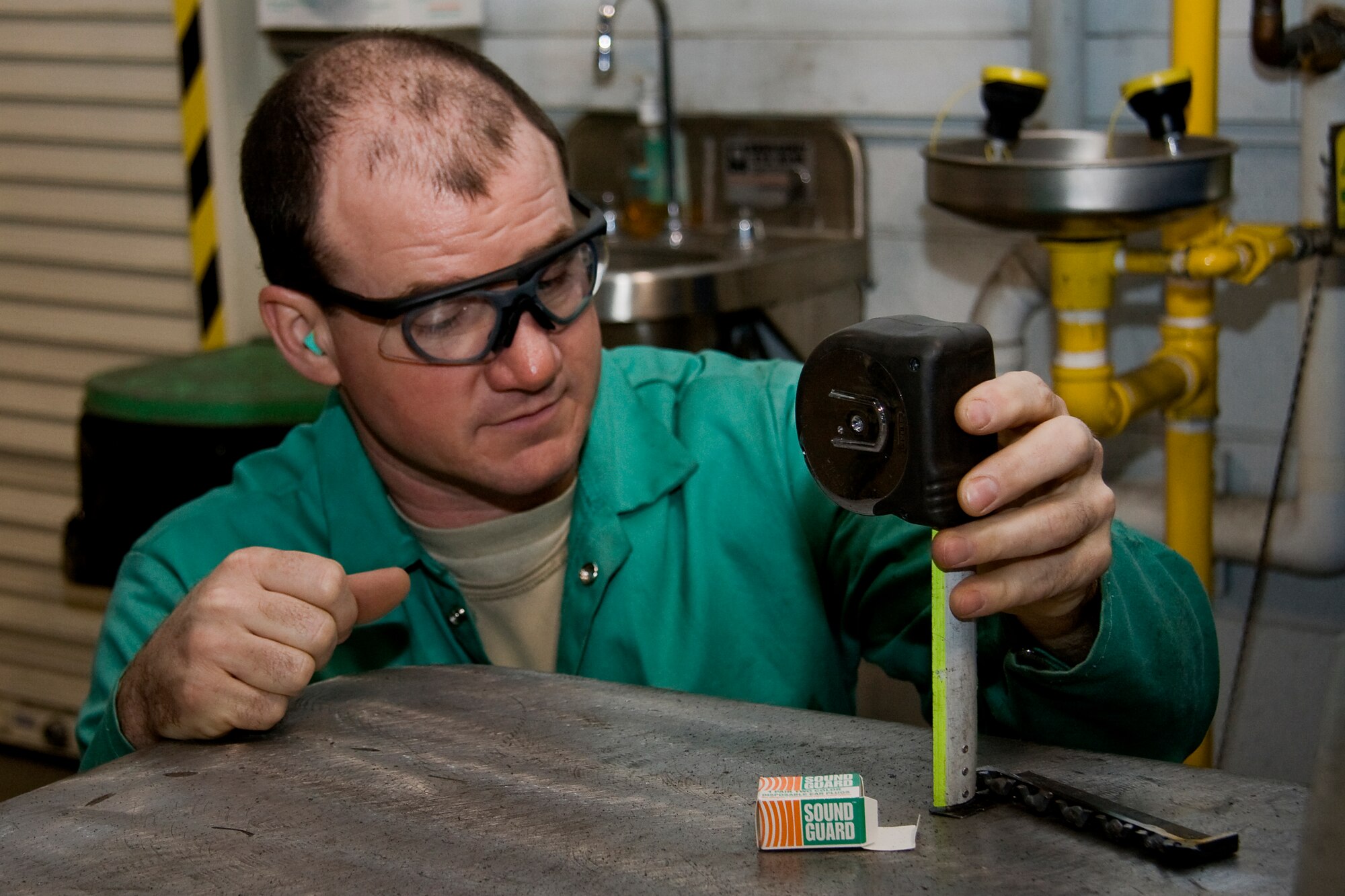 GRISSOM AIR RESERVE BASE, Ind. -- Staff Sgt. Daniel Stout, 434th Maintenance Squadron metal technology apprentice, measures a piece of metal as he works on a safety improvement to a B-5 aircraft maintenance platform here recently. Metals technology Airmen not only work on aircraft equipment and tools, but on my things around base. (U.S. Air Force photo/Tech. Sgt. Mark R. W. Orders-Woempner)
