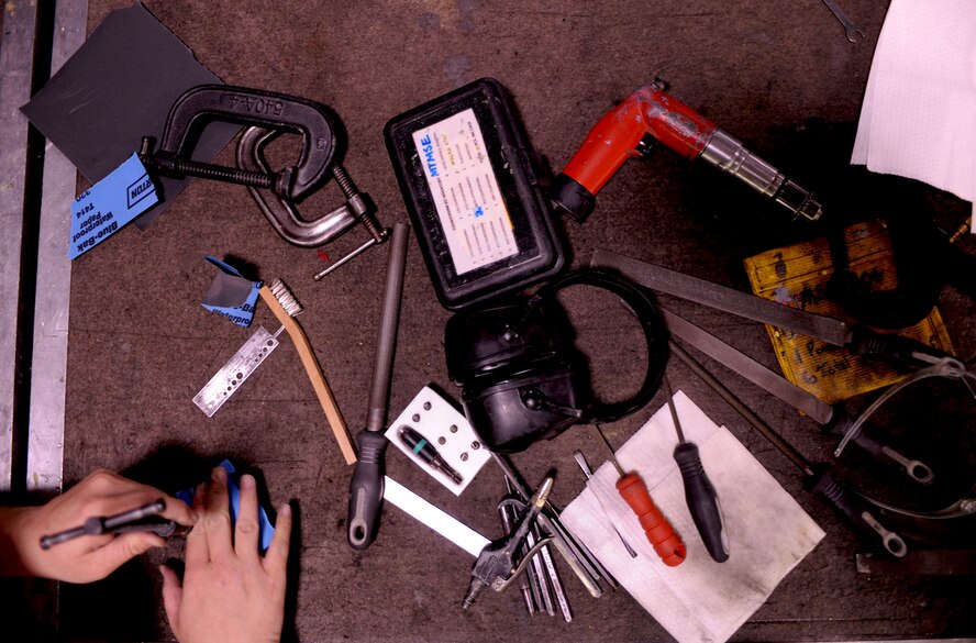 Tools are scattered on a table and inspected during a 23rd Equipment Maintenance Squadron weekly toolbox inspection at Moody Air Force Base, Ga., April 20. These weekly inspections have ensured the accountability of all tools assigned to the 23rd EMS and not a single tool has been lost in nearly a year. (U.S. Air Force photo/Airman 1st Class Benjamin Wiseman)(RELEASED)
