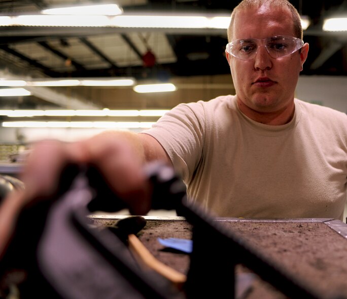 Staff Sgt. Benjamin Baccigalopi, 23rd Equipment Maintenance Squadron aircraft structural maintenance technician, reaches for another tool while conducting a 7-level inspection on one of his shops toolboxes at Moody Air Force Base, Ga., April 20. Sergeant Baccigalopi, inspected every tool and sanded away corrosion when found. He also took accountability of each tool to ensure the tool set was a complete set and no tools were missing. (U.S. Air Force photo/Airman 1st Class Benjamin Wiseman)(RELEASED)