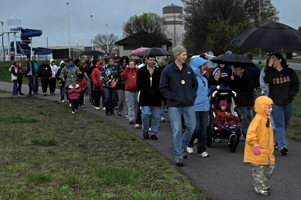 WHITEMAN AIR FORCE BASE, Mo. -- More than 100 members from Team Whiteman walked in support of Take Back the Night hosted by the Sexual Assault Prevention and Response Program April 15. The walkers started at the fitness center track and ended at the Skelton Park where they listened to music, ate free food and socialized. (U.S. Air Force photo by Capt. John Severns)
