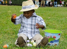 An excited two-year-old Cshammar Reed, looks through his stash of collected eggs after completing an Easter egg hunt during the annual Eggstravaganza event held at Marrington Plantation on Joint Base Charleston-Weapons Station April, 16. The event was sponsored by Morale, Welfare and Recreation in conjunction with the Month of the Military child, and provided a fun-filled day for the whole family. Cshammar is the son of Machinist's Mate 3rd Class Pakisha Johnson. (U.S. Navy photo/Mass Communication Specialist 1st Class Jennifer Hudson) 

